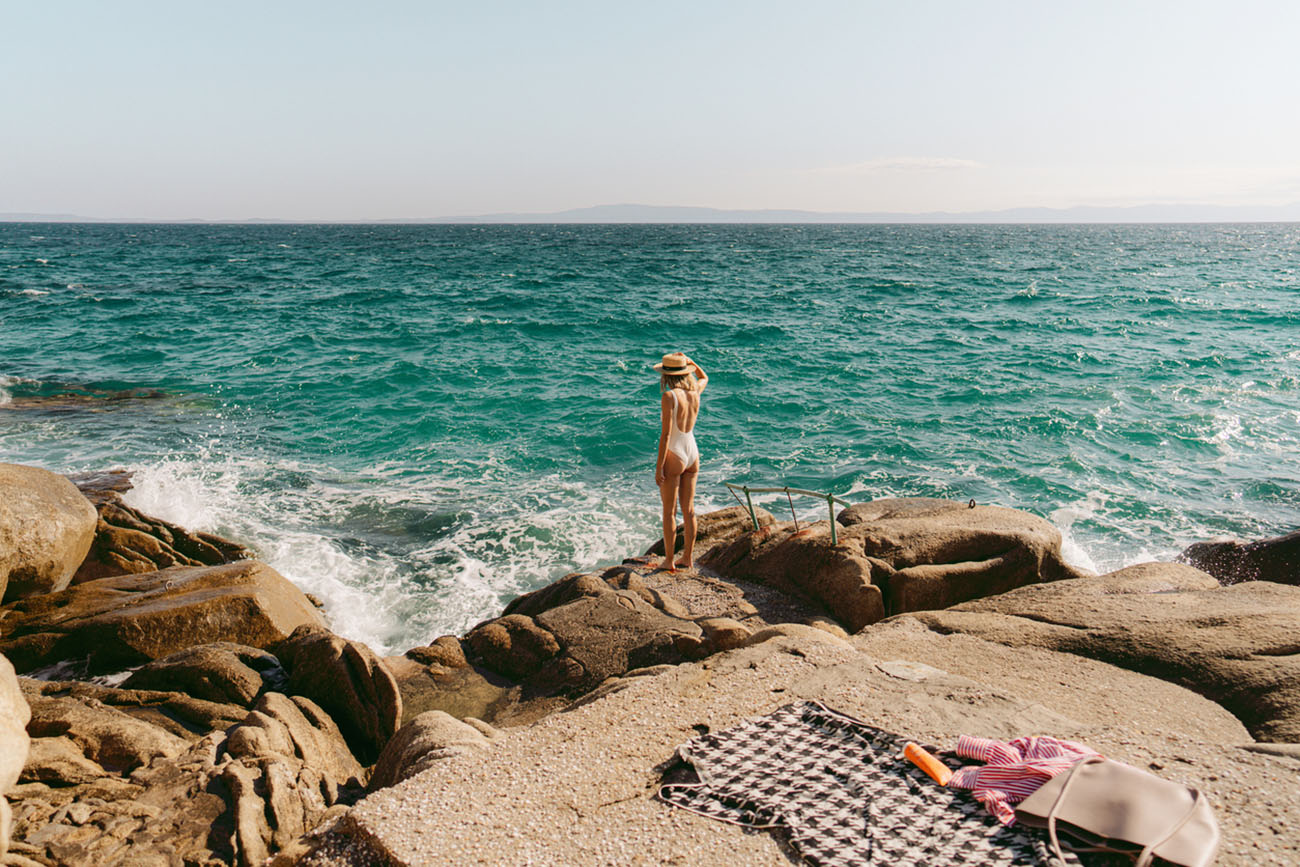 Photo of a woman traveling solo by the sea