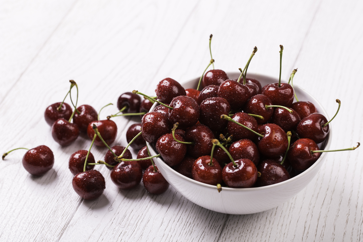 fresh cherry on white wooden table