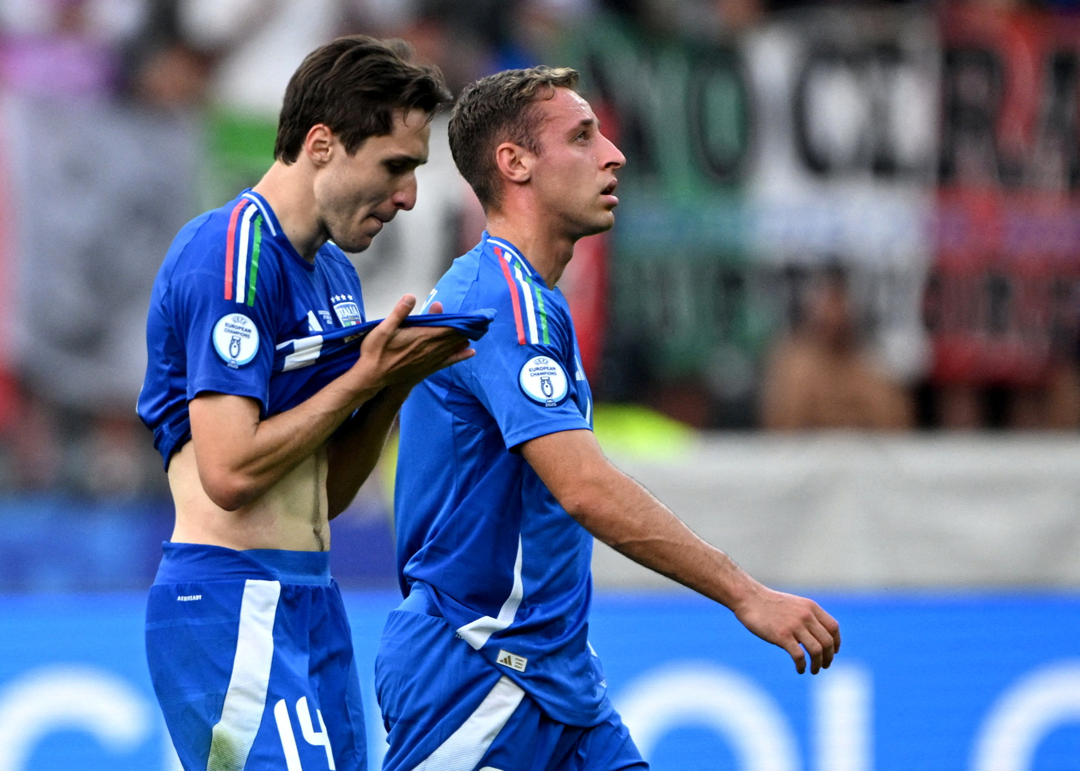 Soccer Football - Euro 2024 - Round of 16 - Switzerland v Italy - Berlin Olympiastadion, Berlin, Germany - June 29, 2024  Italy's Federico Chiesa and Davide Frattesi look dejected after the match REUTERS