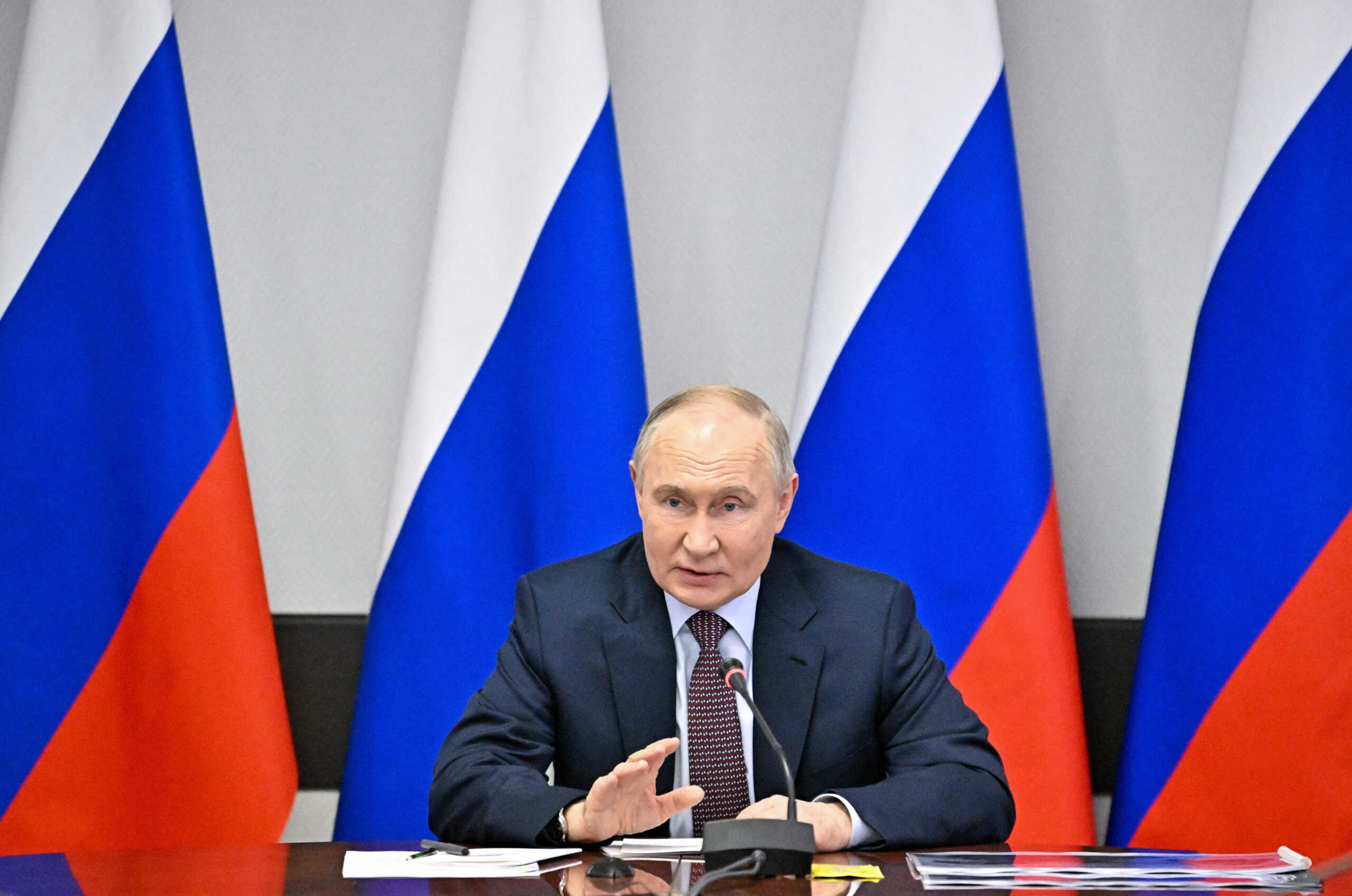 Russian President Vladimir Putin chairs a meeting with officials and heads of the country's military industrial sector outside Moscow, Russia, May 25, 2024. Sputnik