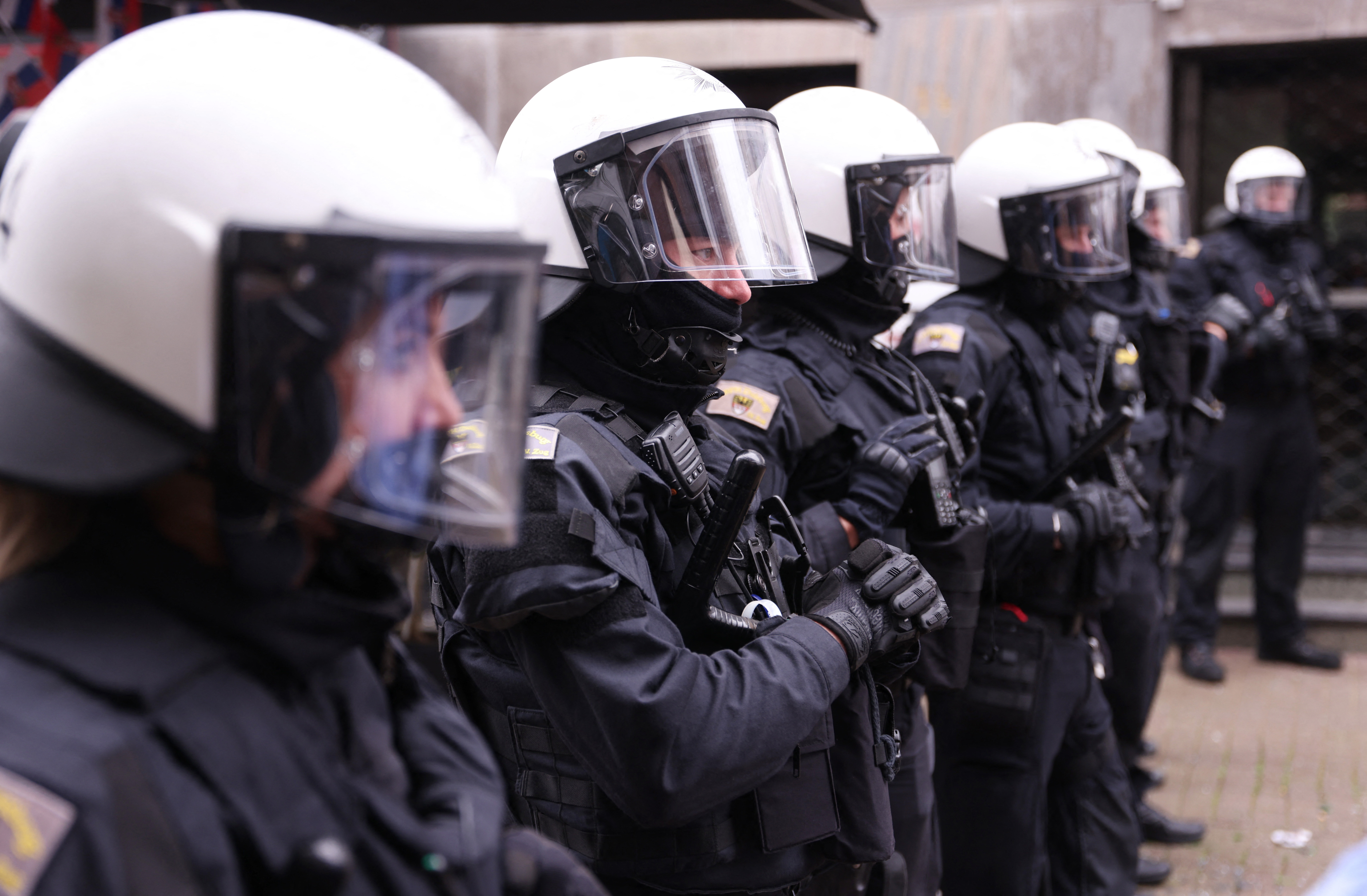 Soccer Football - Euro 2024 - Fans gather before England v Serbia - Gelsenkirchen, Germany - June 16, 2024 Police officers secure the area after clashes between fans ahead of the match REUTERS