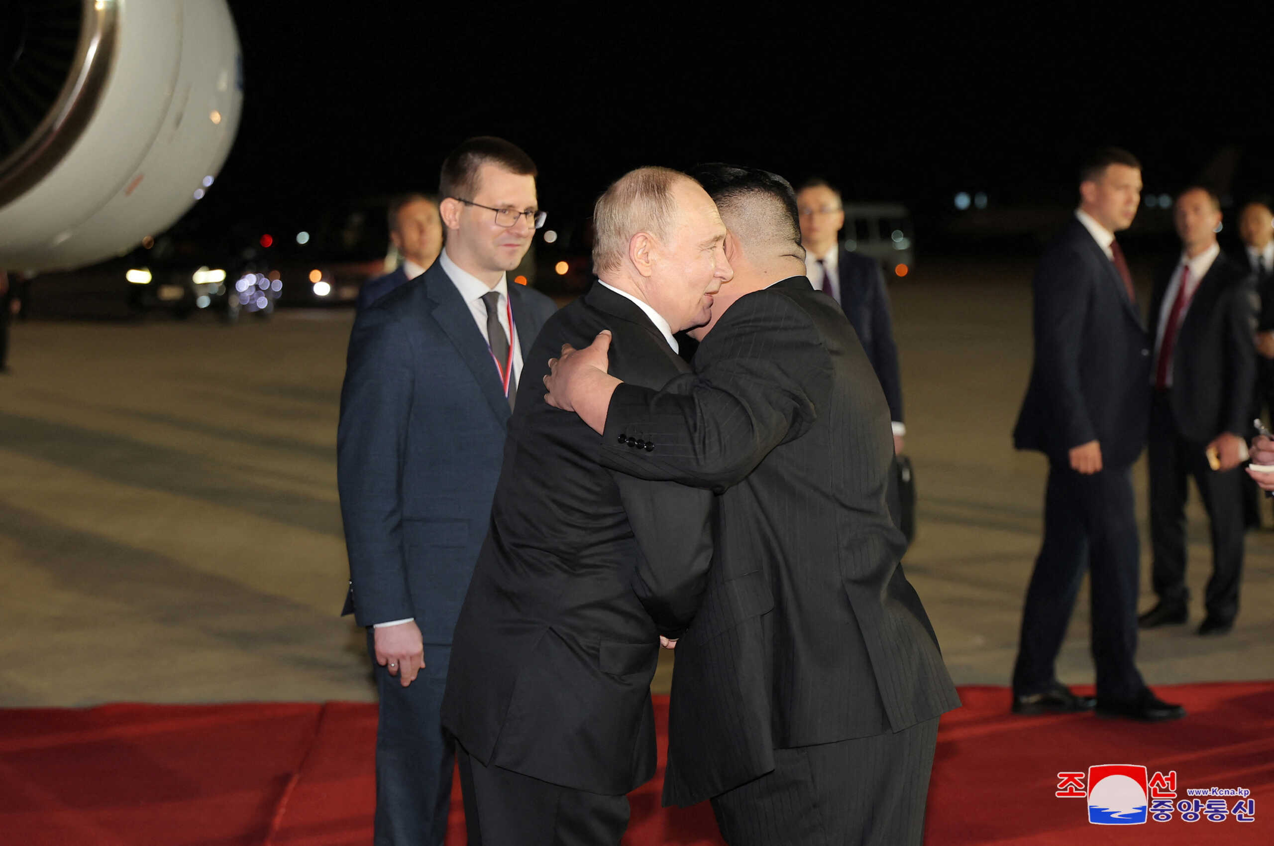 Russian President Vladimir Putin embraces North Korean leader Kim Jong Un upon his arrival at an airport in Pyongyang, North Korea, in this image released by the Korean Central News Agency June 19, 2024. KCNA via REUTERS ATTENTION EDITORS - THIS IMAGE WAS PROVIDED BY A THIRD PARTY. REUTERS IS UNABLE TO INDEPENDENTLY VERIFY THIS IMAGE. NO THIRD PARTY SALES. SOUTH KOREA OUT. NO COMMERCIAL OR EDITORIAL SALES IN SOUTH KOREA.