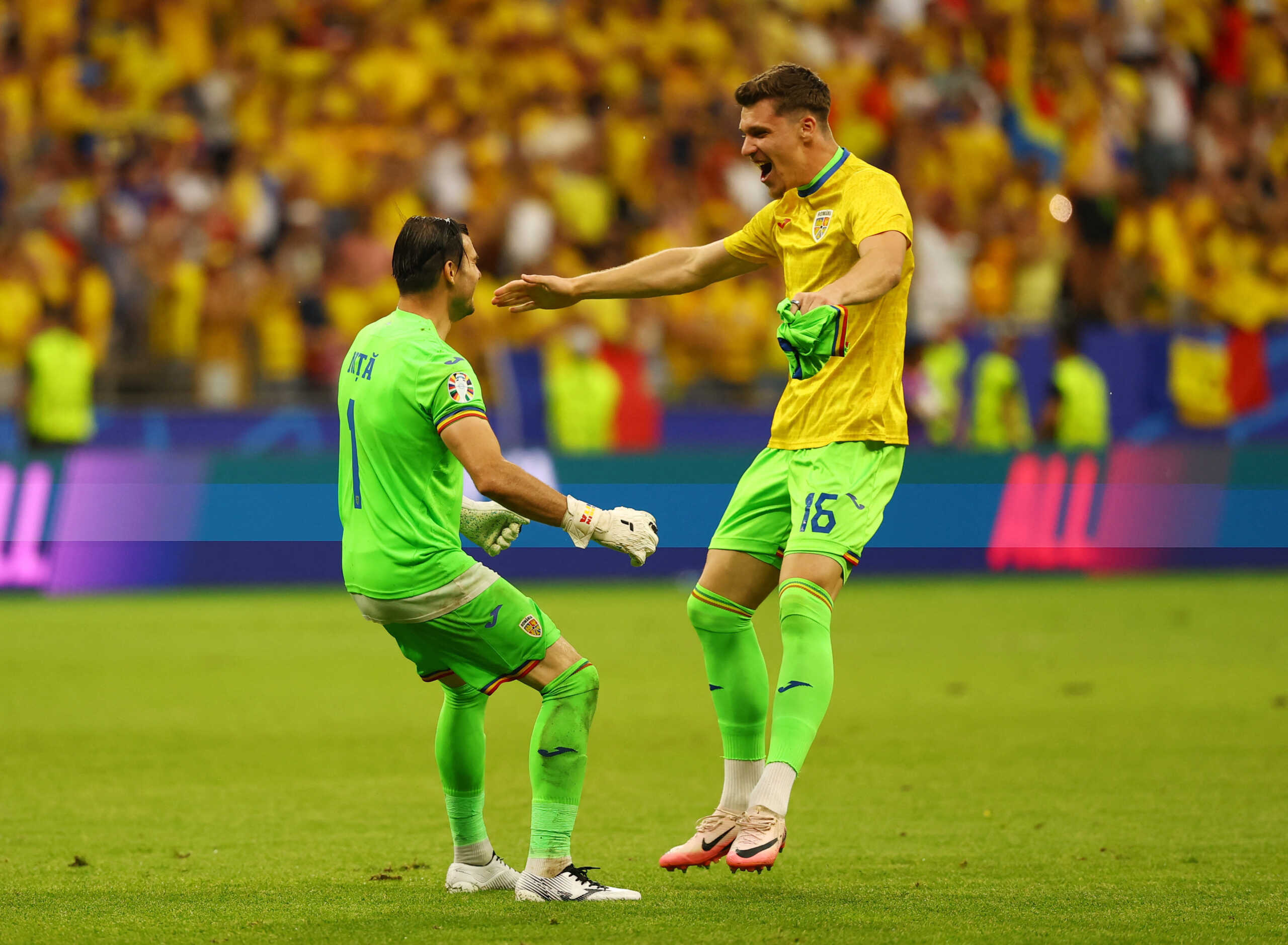 Soccer Football - Euro 2024 - Group E - Slovakia v Romania - Frankfurt Arena, Frankfurt, Germany - June 26, 2024 Romania's Florin Nita and Stefan Tarnovanu celebrate after the match REUTERS