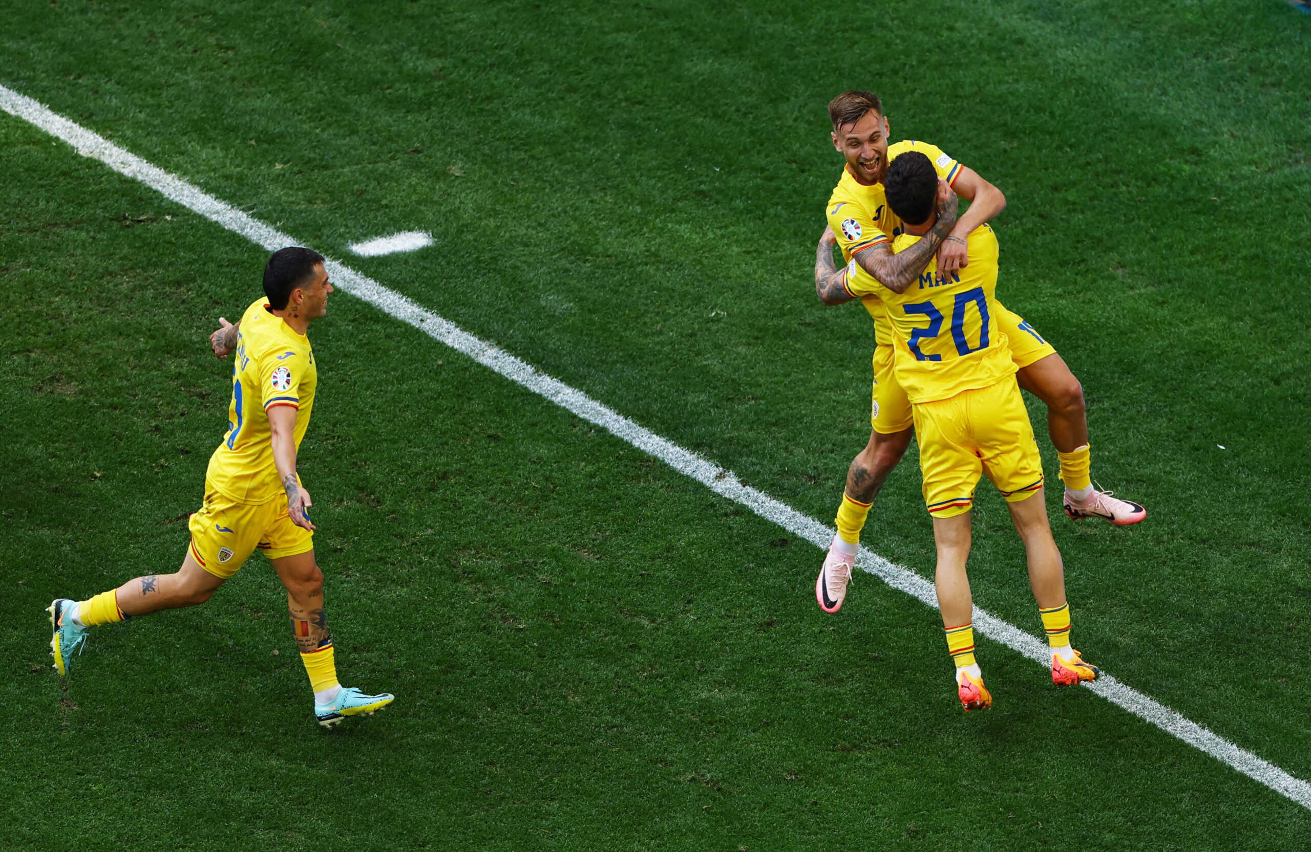 Soccer Football - Euro 2024 - Group E - Romania v Ukraine - Munich Football Arena, Munich, Germany - June 17, 2024 Romania's Denis Dragus in action with Dennis Man REUTERS