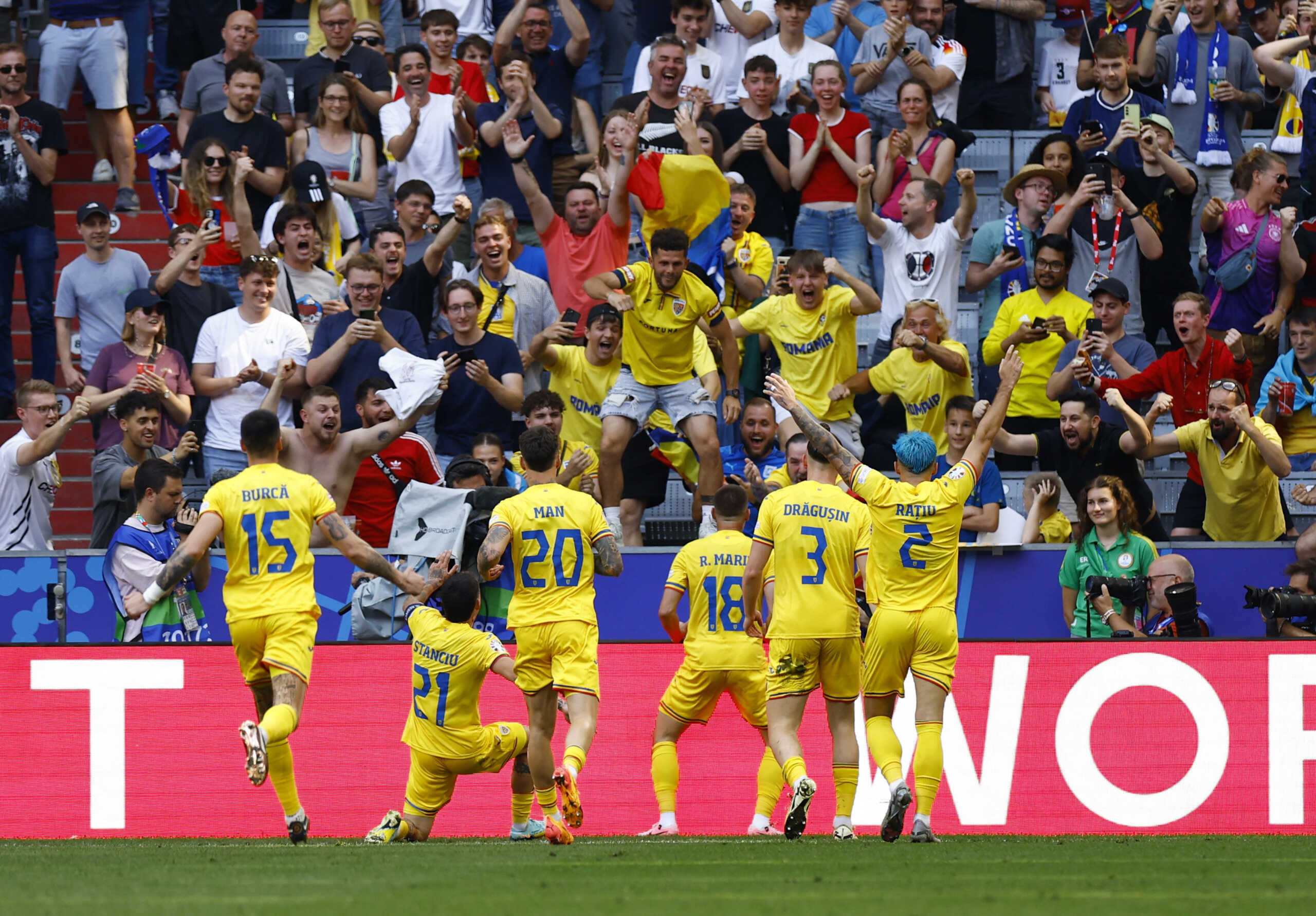 Soccer Football - Euro 2024 - Group E - Romania v Ukraine - Munich Football Arena, Munich, Germany - June 17, 2024 Romania's Razvan Marin celebrates scoring their second goal with teammates and fans REUTERS
