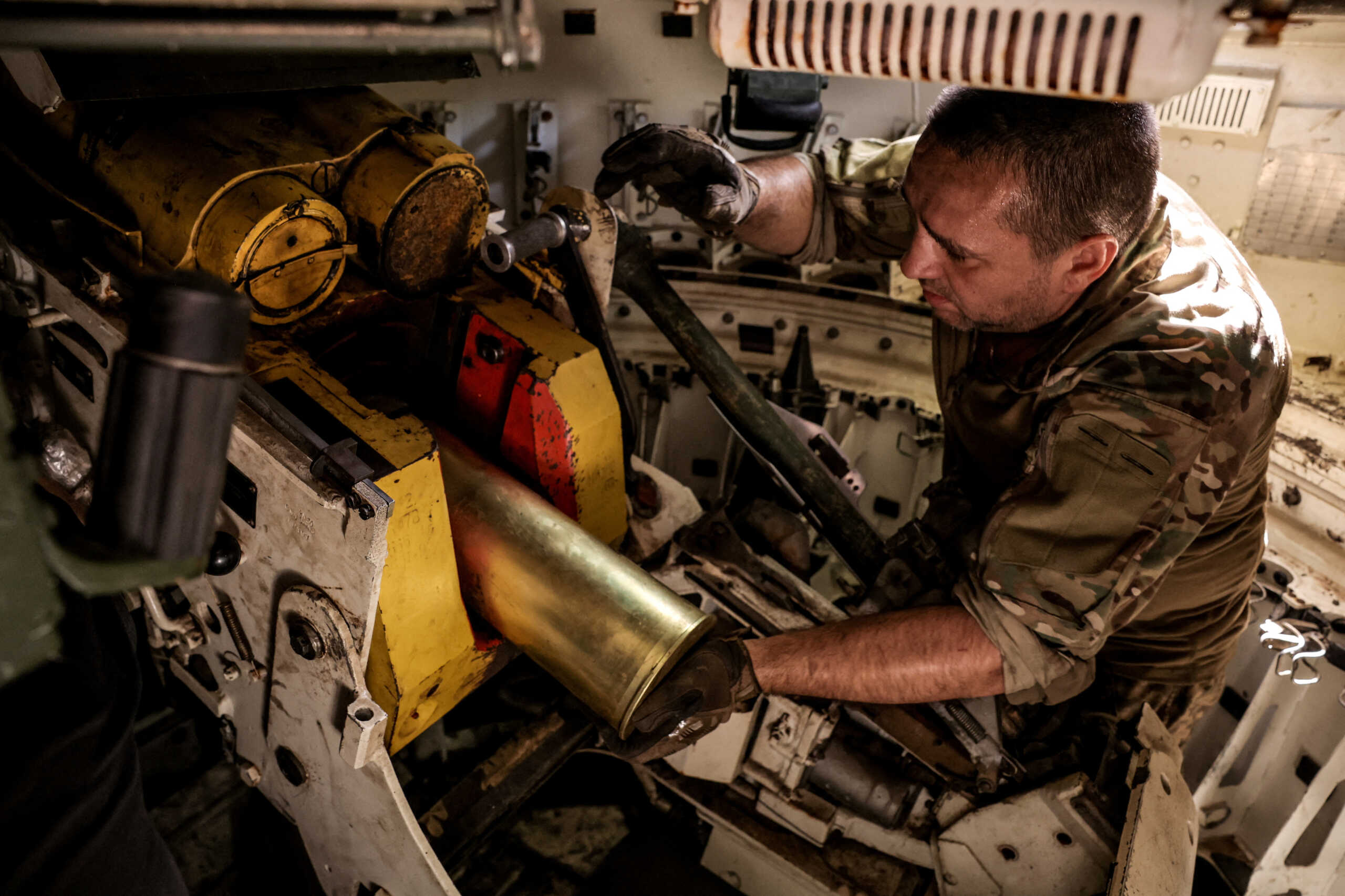 FILE PHOTO: A serviceman of the 24th Mechanized brigade named after King Danylo of the Ukrainian Armed Forces loads a shell inside a 2S1 Gvozdika self-propelled howitzer while firing towards Russian troops in a front line, amid Russia's attack on Ukraine, near the town of Chasiv Yar in Donetsk region, Ukraine  June 22, 2024. Oleg Petrasiuk