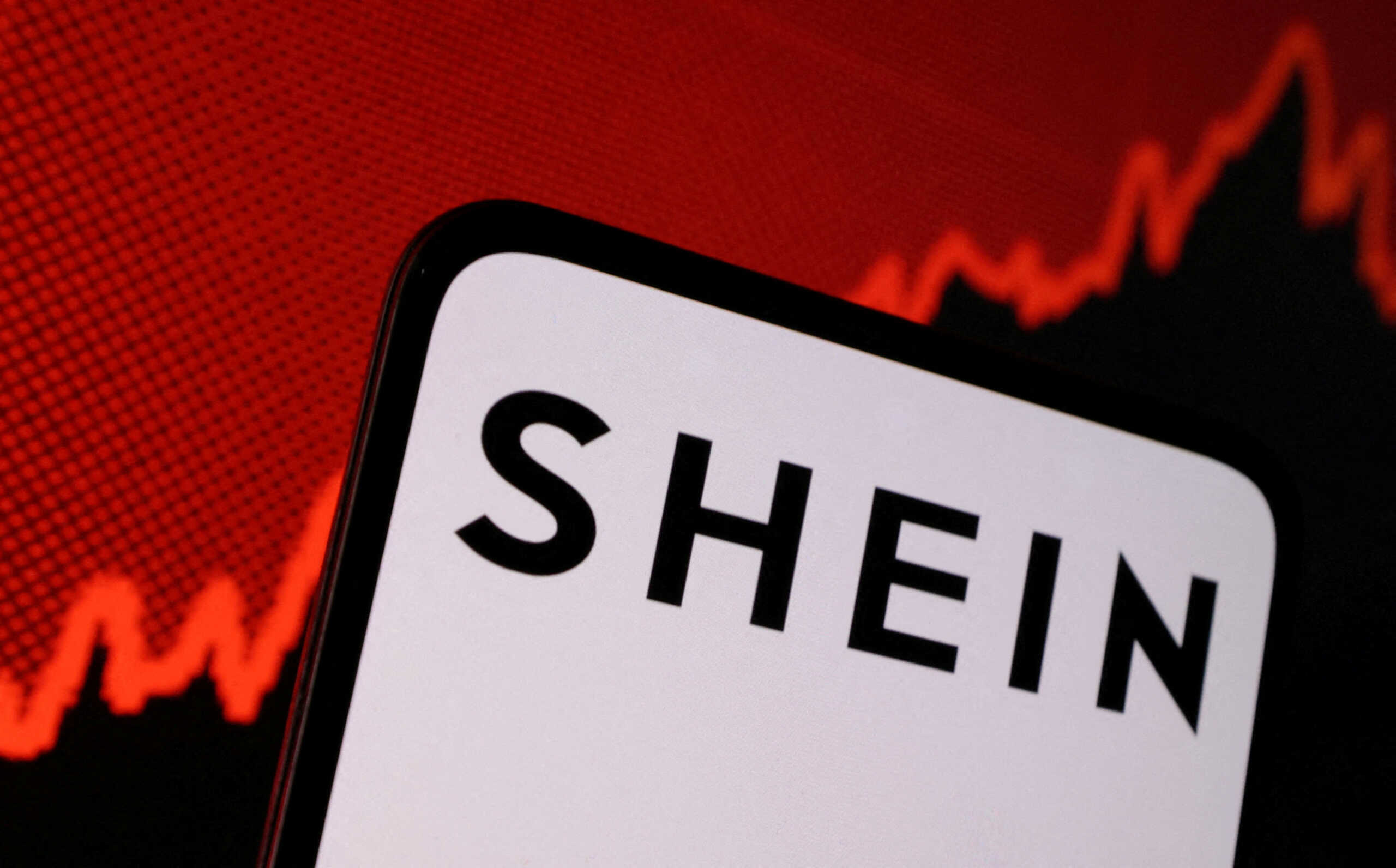 Shein logo and stock graph are seen in this illustration taken, May 16, 2024. REUTERS