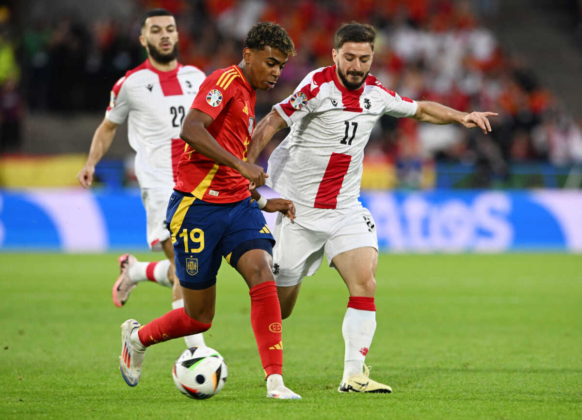 Soccer Football - Euro 2024 - Round of 16 - Spain v Georgia - Cologne Stadium, Cologne, Germany - June 30, 2024 Spain's Lamine Yamal in action with Georgia's Otar Kiteishvili REUTERS