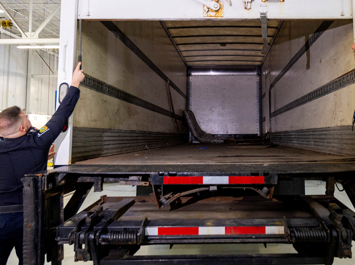 FILE PHOTO: Police officers open the back of the truck used in the heist after authorities gave details of the arrests made one year after some 400 kg (882 pounds) of gold and almost $2 million USD in cash was stolen from Toronto Pearson International Airport, at a news conference in Brampton, Ontario, Canada April 17, 2024.  REUTERS