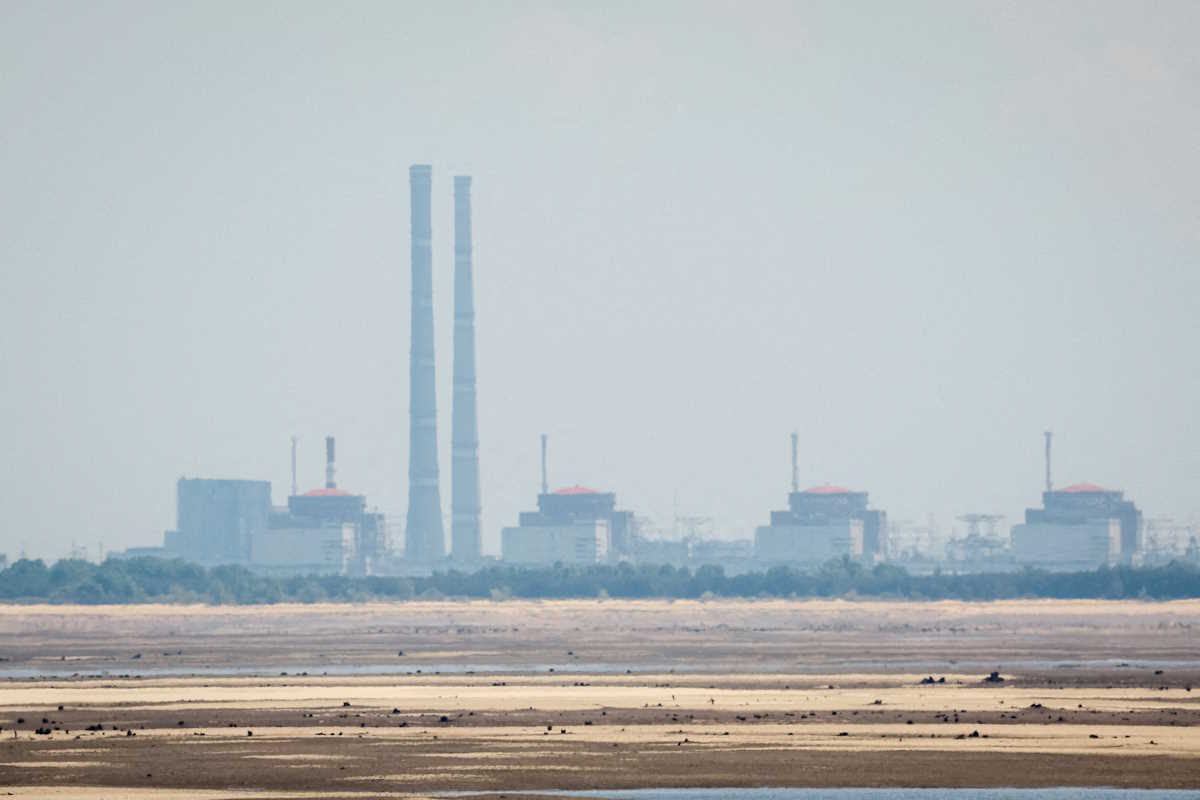 FILE PHOTO: A view shows Zaporizhzhia Nuclear Power Plant from the bank of Kakhovka Reservoir near the town of Nikopol, amid Russia's attack on Ukraine, in Dnipropetrovsk region, Ukraine June 16, 2023. REUTERS