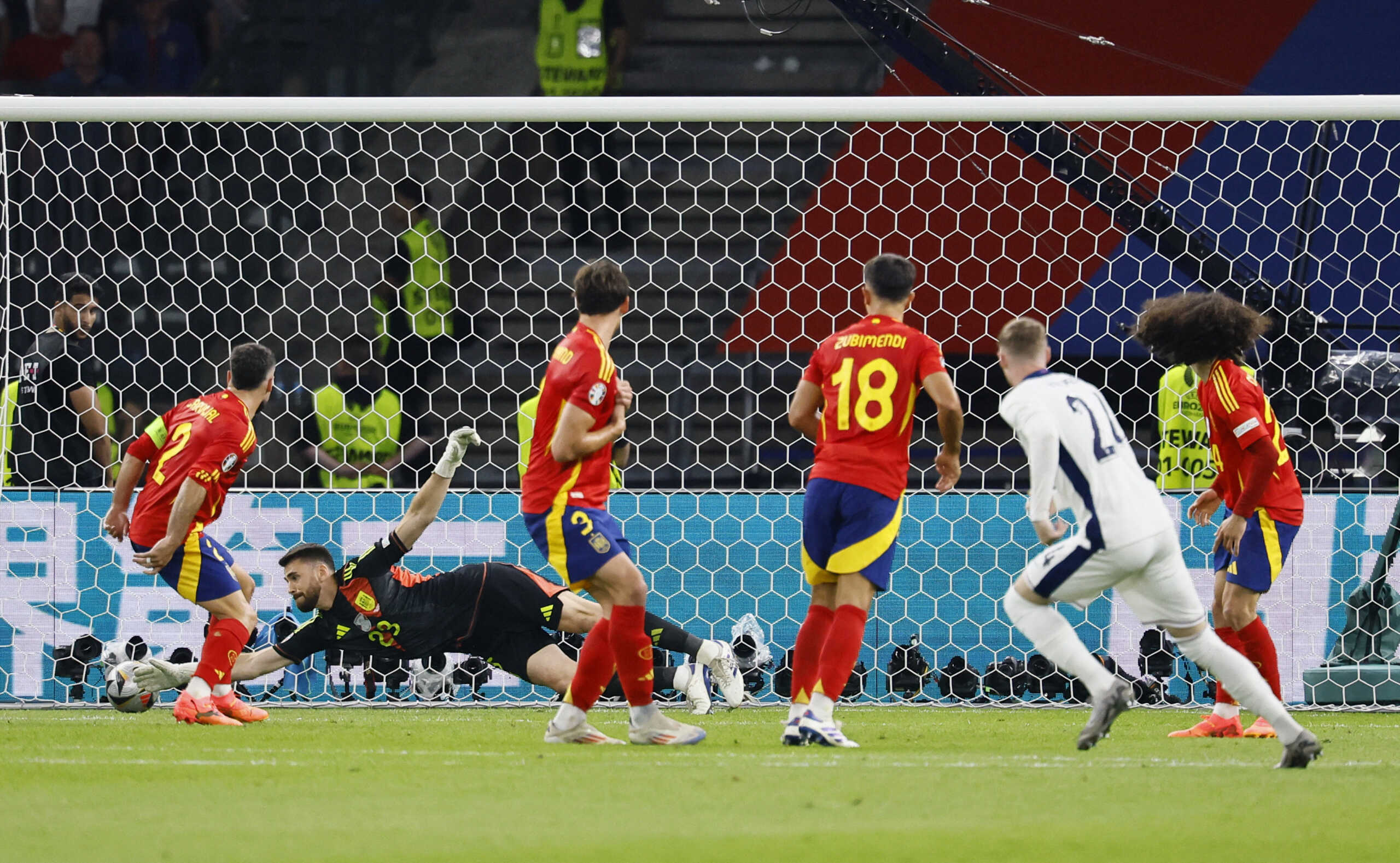 Soccer Football - Euro 2024 - Final - Spain v England - Berlin Olympiastadion, Berlin, Germany - July 14, 2024 England's Cole Palmer scores their first goal past Spain's Unai Simon REUTERS