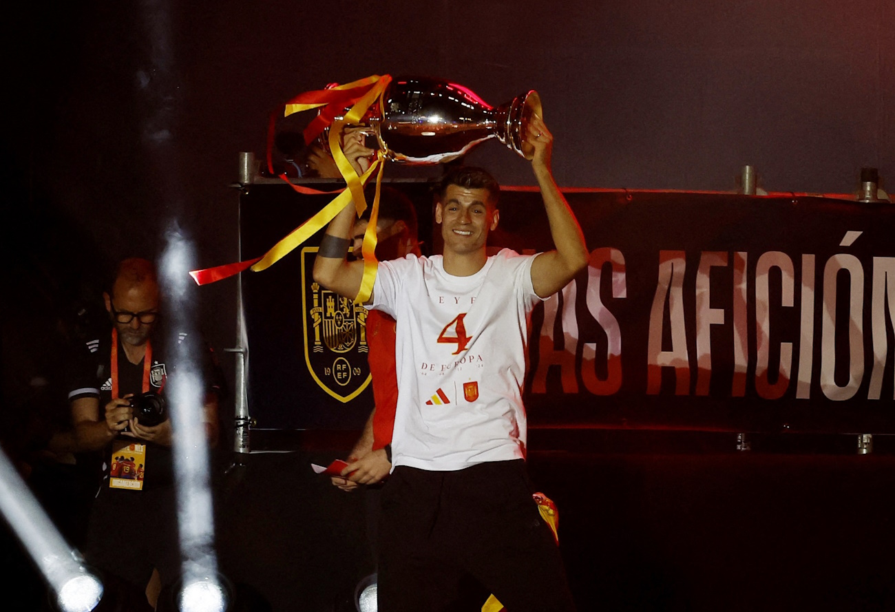 Soccer Football - Euro 2024 - Spain Parade after winning Euro 2024 - Madrid, Spain - July 15, 2024 Spain's Alvaro Morata is seen with the trophy during celebrations on Plaza Cibeles after winning Euro 2024 REUTERS