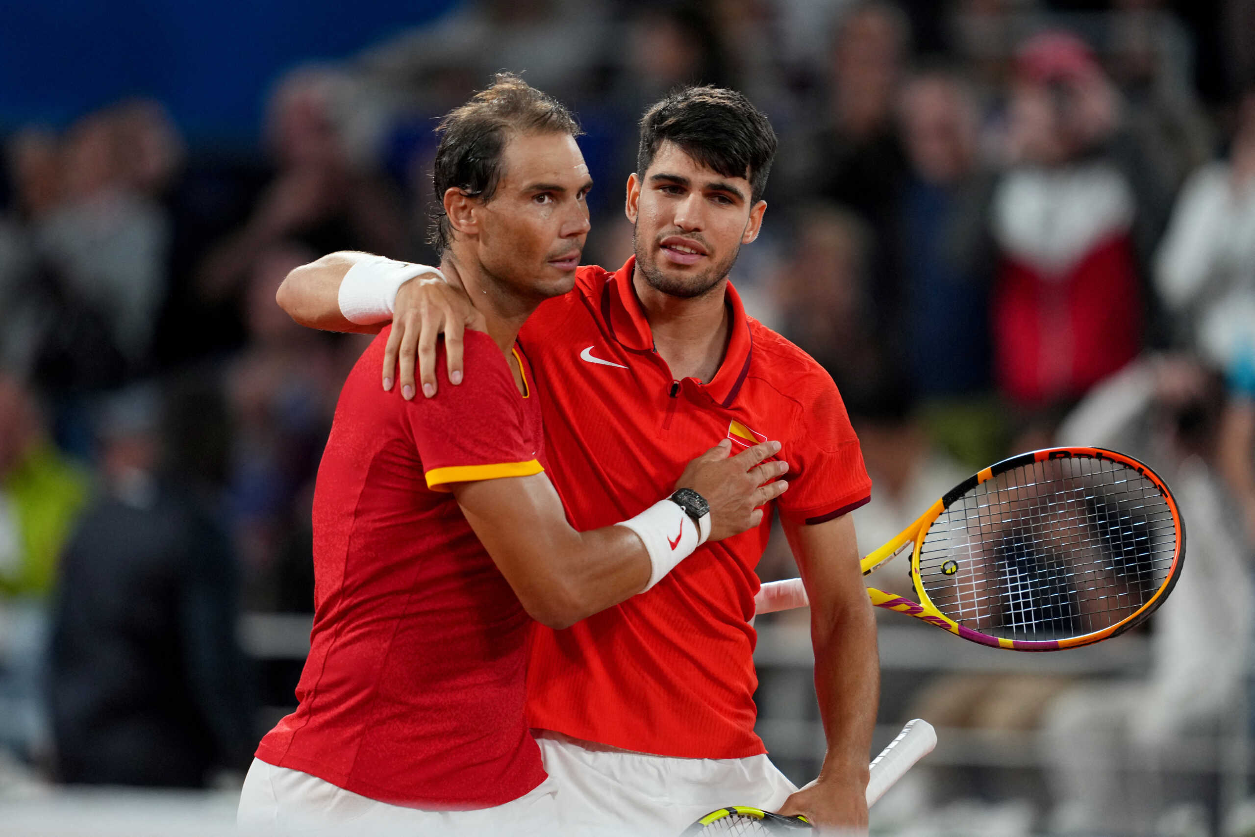 Paris 2024 Olympics - Tennis - Men's Doubles First Round - Roland-Garros Stadium, Paris, France - July 27, 2024. Carlos Alcaraz of Spain and Rafael Nadal of Spain celebrate after winning their first round match against Maximo Gonzalez of Argentina and Andres Molteni of Argentina. REUTERS
