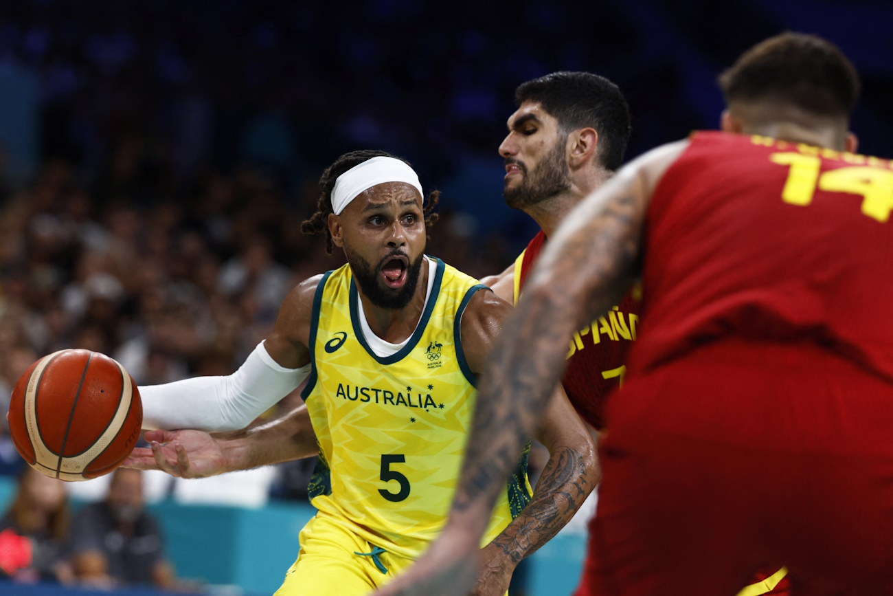 Paris 2024 Olympics - Basketball - Men's Group Phase - Group A - Australia vs Spain - Pierre Mauroy Stadium, Villeneve-d'Ascq, France - July 27, 2024. Patty Mills of Australia in action against Santi Aldama of Spain at Lille's Pierre Mauroy stadium in Villenuve D'Ascq REUTERS