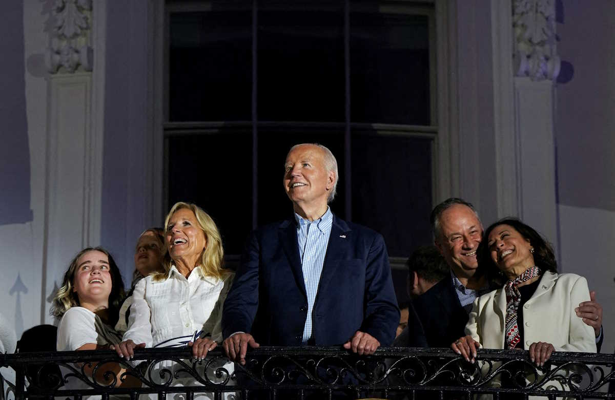 U.S. President Joe Biden, first lady Jill Biden, U.S. Vice President Kamala Harris and second gentleman Douglas C. Emhoff stand on the balcony as they watch fireworks during an Independence Day celebration on the South Lawn of the White House in Washington, U.S., July 4, 2024. REUTERS