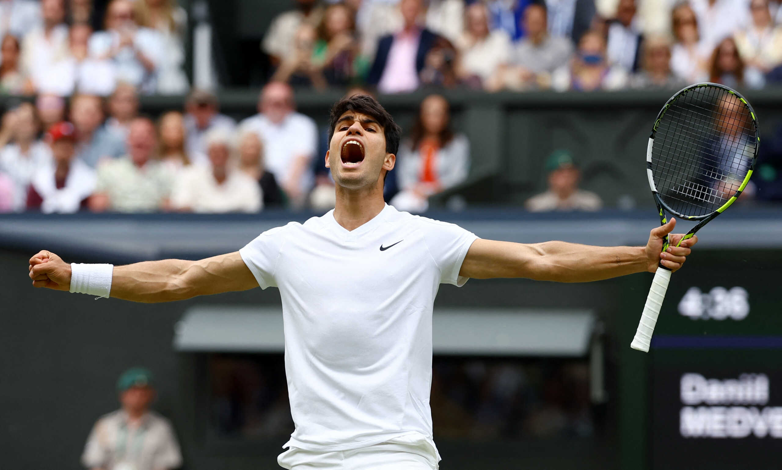 Tennis - Wimbledon - All England Lawn Tennis and Croquet Club, London, Britain - July 12, 2024  Spain's Carlos Alcaraz celebrates after winning his semi final match against Russia's Daniil Medvedev REUTERS