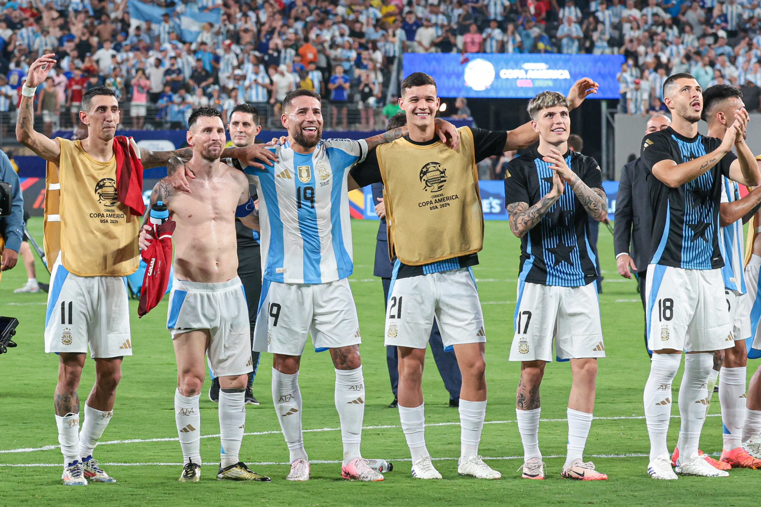 Jul 9, 2024; East Rutherford, NJ, USA; Argentina forward Angel Di Maria (11) and forward Lionel Messi (10) celebrates with teammates  after the match against Canada at Metlife Stadium. Mandatory Credit: Vincent Carchietta-USA TODAY Sports