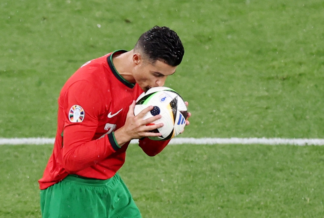 Soccer Football - Euro 2024 - Group F - Portugal v Czech Republic - Leipzig Stadium, Leipzig, Germany - June 18, 2024  Portugal's Cristiano Ronaldo kisses the ball REUTERS