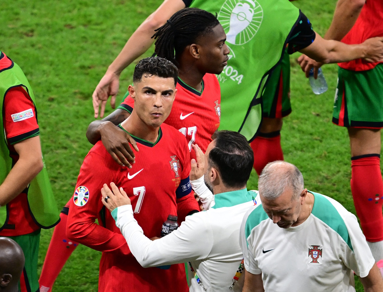 Soccer Football - Euro 2024 - Round of 16 - Portugal v Slovenia - Frankfurt Arena, Frankfurt, Germany - July 1, 2024  Portugal's Cristiano Ronaldo with coaching staff and Rafael Leao as he reacts REUTERS