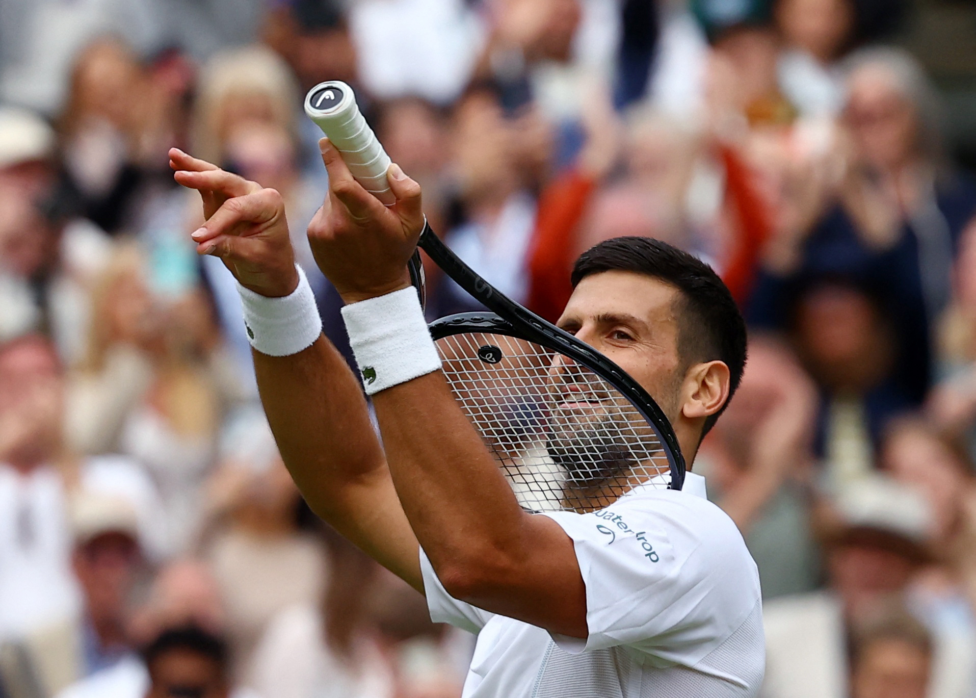 Tennis - Wimbledon - All England Lawn Tennis and Croquet Club, London, Britain - July 12, 2024  Serbia's Novak Djokovic celebrates after winning his semi final match against Italy's Lorenzo Musetti REUTERS
