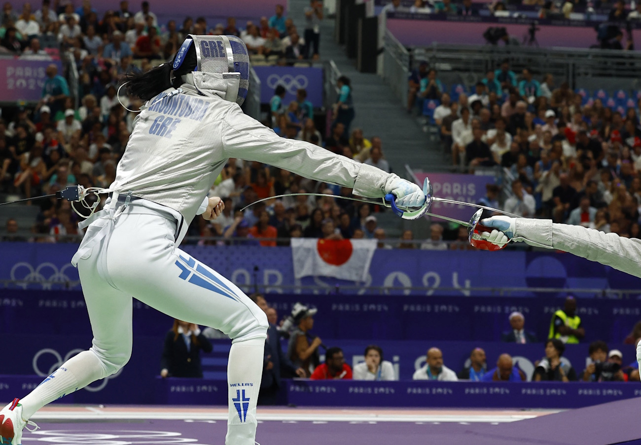 Paris 2024 Olympics - Fencing - Women's Sabre Individual Table of 32 - Grand Palais, Paris, France - July 29, 2024. Theodora Gkountoura of Greece in action against Pamela Brind'amour of Canada. REUTERS