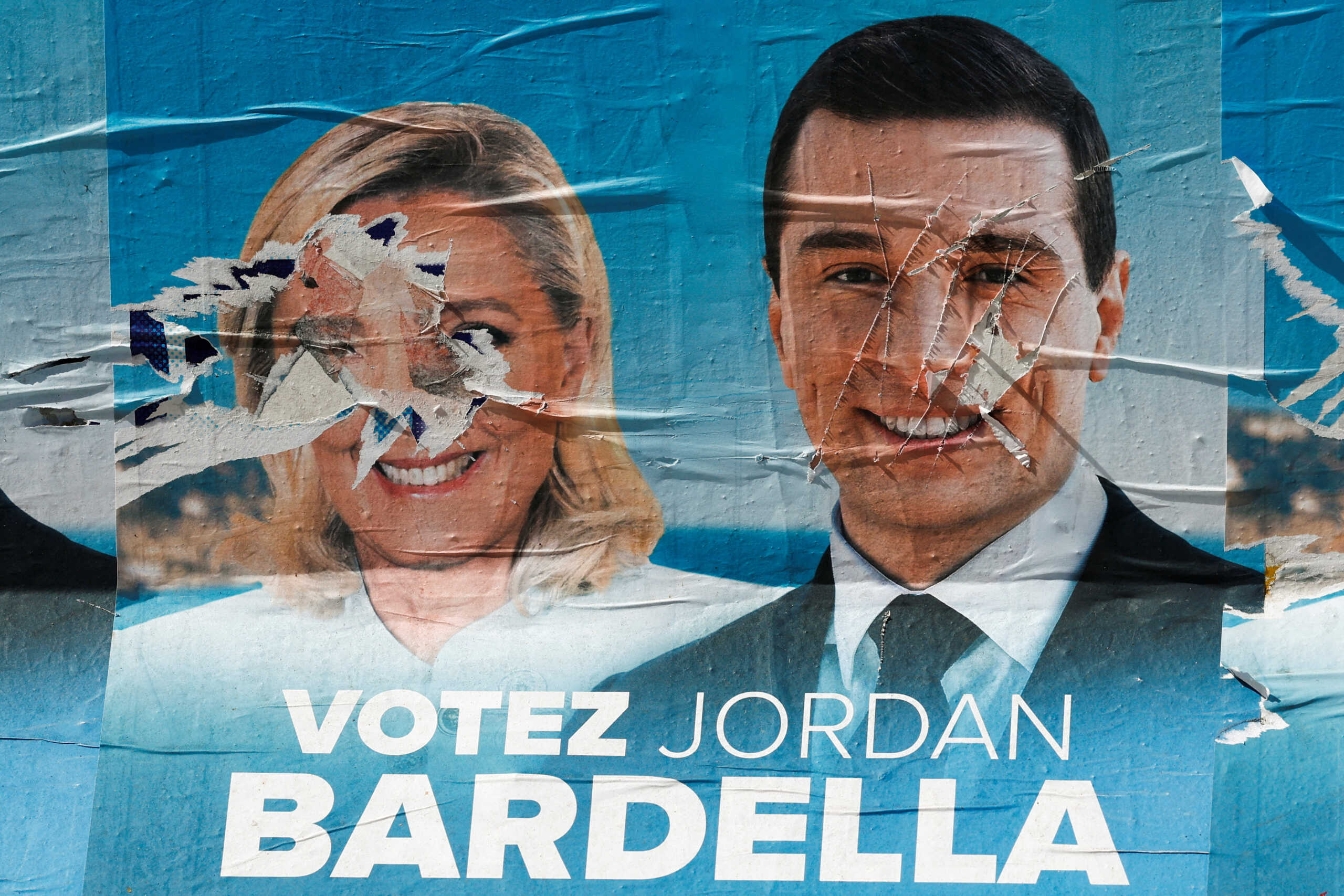 FILE PHOTO: Election posters of the French far-right National Rally (Rassemblement National - RN) party with pictures of their leaders Marine Le Pen and Jordan Bardella are seen near the RN party headquarters before the second round of the early French parliamentary elections, in Paris, France, July 5, 2024. REUTERS