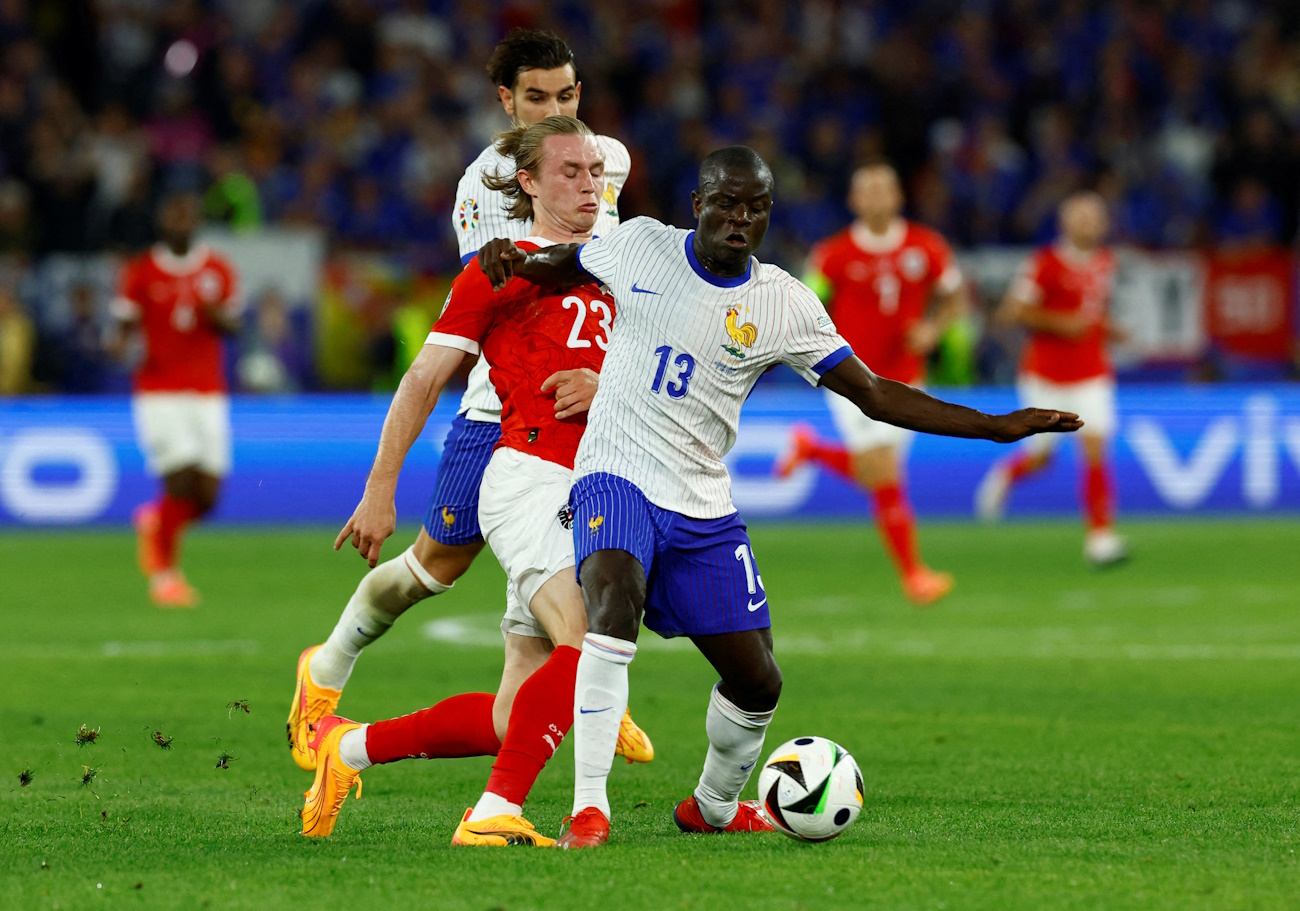 FILE PHOTO: Soccer Football - Euro 2024 - Group D - Austria v France - Dusseldorf Arena, Dusseldorf, Germany - June 17, 2024 France's Theo Hernandez and N'Golo Kante in action with Austria's Patrick Wimmer REUTERS