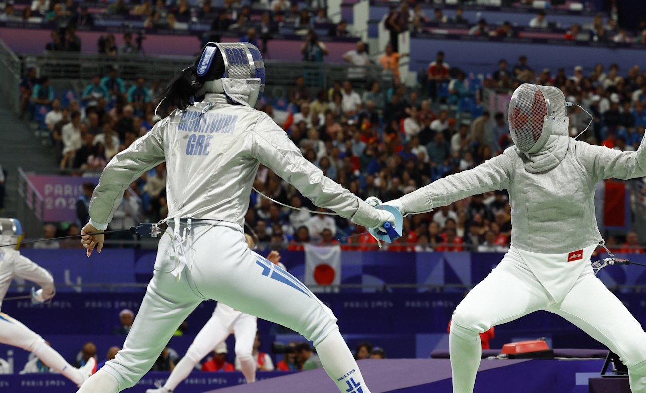 Paris 2024 Olympics - Fencing - Women's Sabre Individual Table of 32 - Grand Palais, Paris, France - July 29, 2024. Theodora Gkountoura of Greece in action against Pamela Brind'amour of Canada. REUTERS