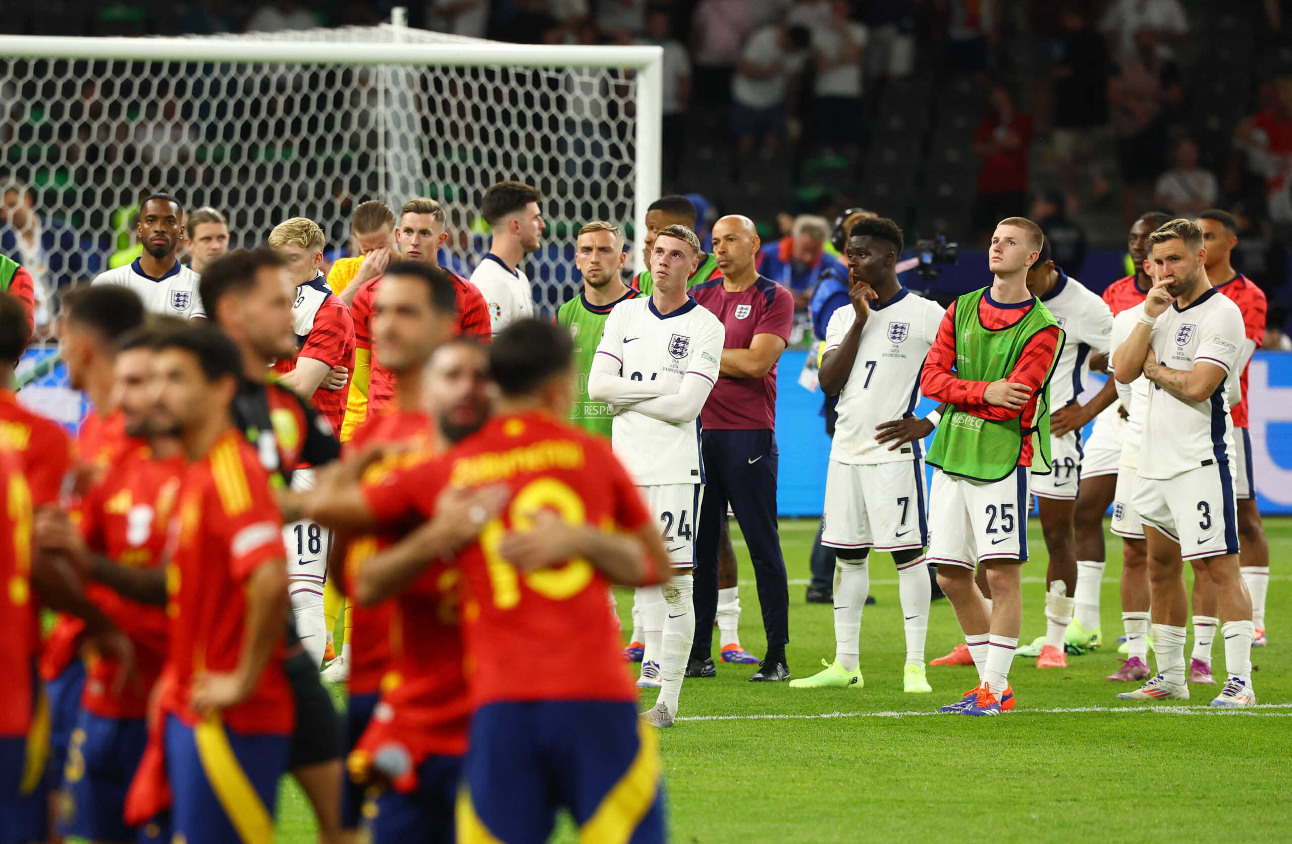 Soccer Football - Euro 2024 - Final - Spain v England - Berlin Olympiastadion, Berlin, Germany - July 14, 2024 England's Cole Palmer, Bukayo Saka, Adam Wharton and Luke Shaw look dejected after the match REUTERS