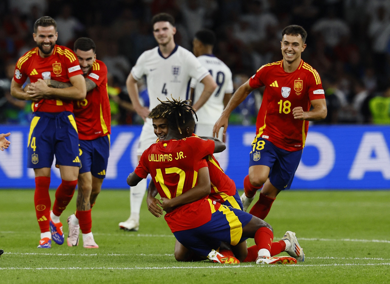 Soccer Football - Euro 2024 - Final - Spain v England - Berlin Olympiastadion, Berlin, Germany - July 14, 2024 Spain's Lamine Yamal and Nico Williams celebrate after the match REUTERS