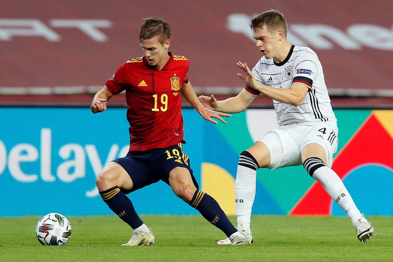 epa08826150 Spanish national soccer team midfielder Dani Olmo (L) fights with Matthias Ginter (R) of Germany, during the UEFA Nations League soccer match, group 4, between Spain and Germany at La Cartuja Stadium in Sevilla, Spain, 17 November 2020.  EPA