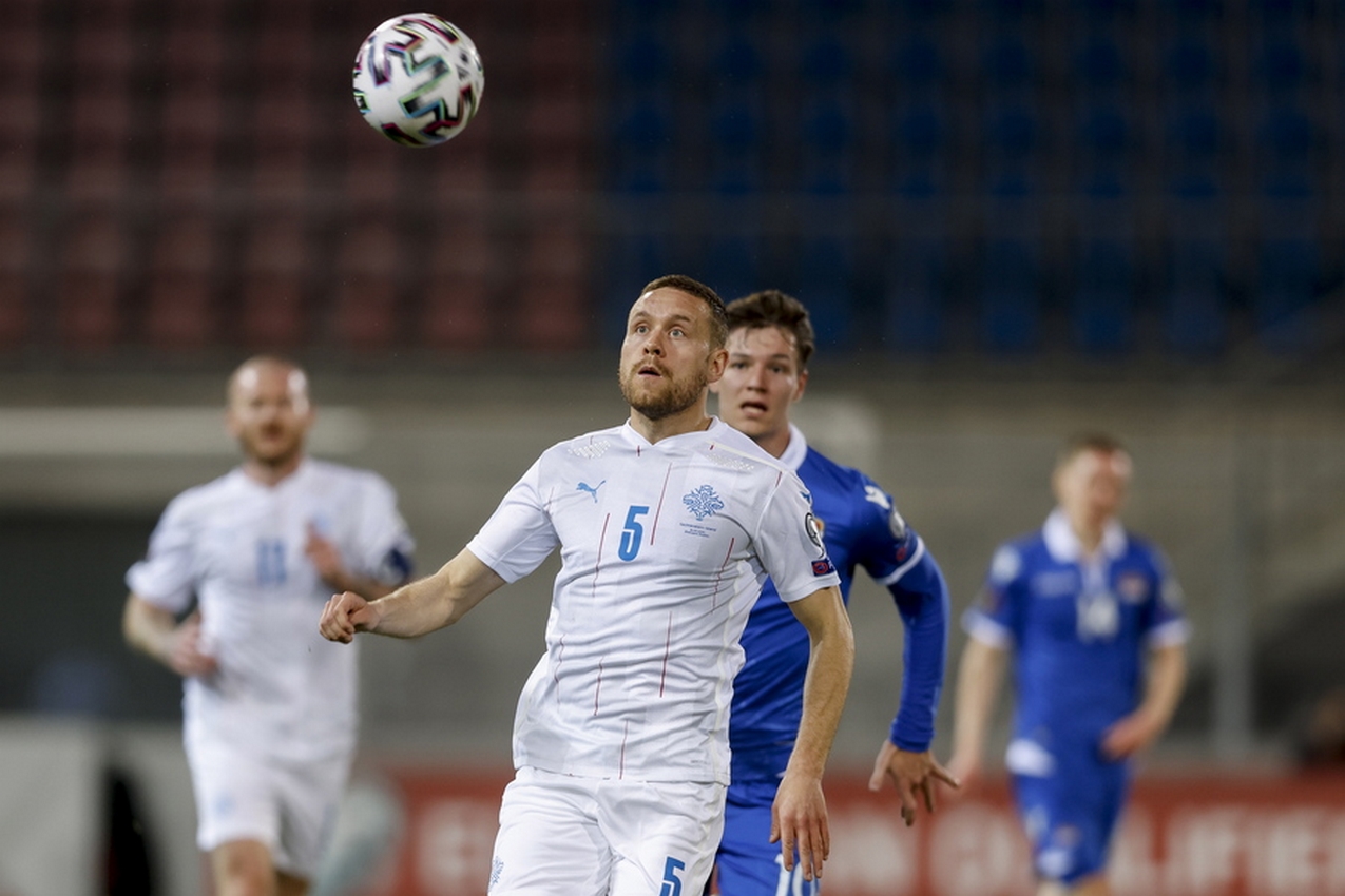 epa09109313 Iceland's Sverrir Ingason (front) in action during the FIFA World Cup 2022 qualifying group J soccer match between Liechtenstein and Iceland in Vaduz, Liechtenstein, 31 March 2021.  EPA