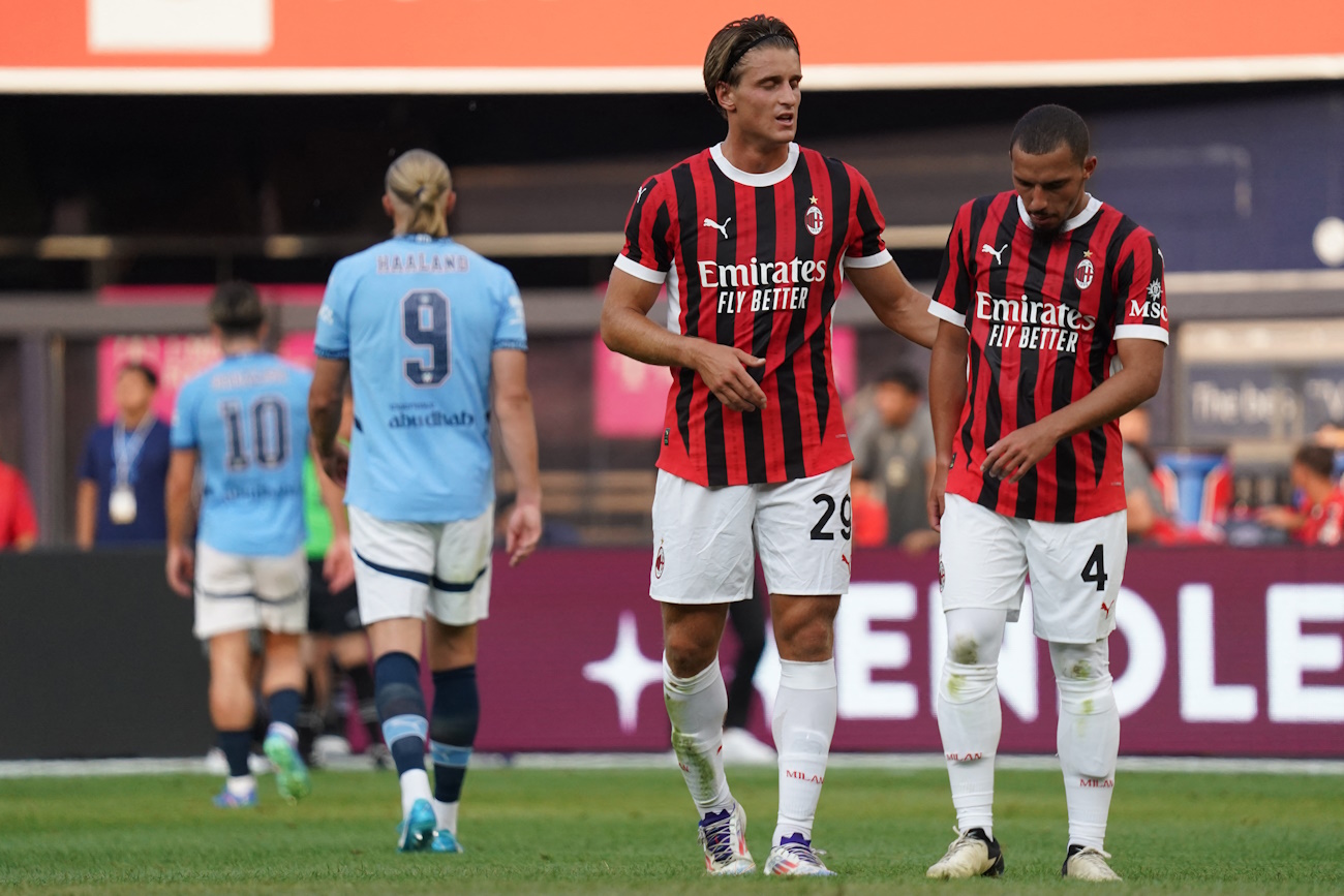 Jul 27, 2024; New York, NY, USA; AC Milan forward Lorenzo Colombo (29) talks with AC Milan midfielder Ismael Bennacer (4) during the first half against Manchester City at Yankee Stadium. Mandatory Credit: Lucas Boland-USA TODAY Sports