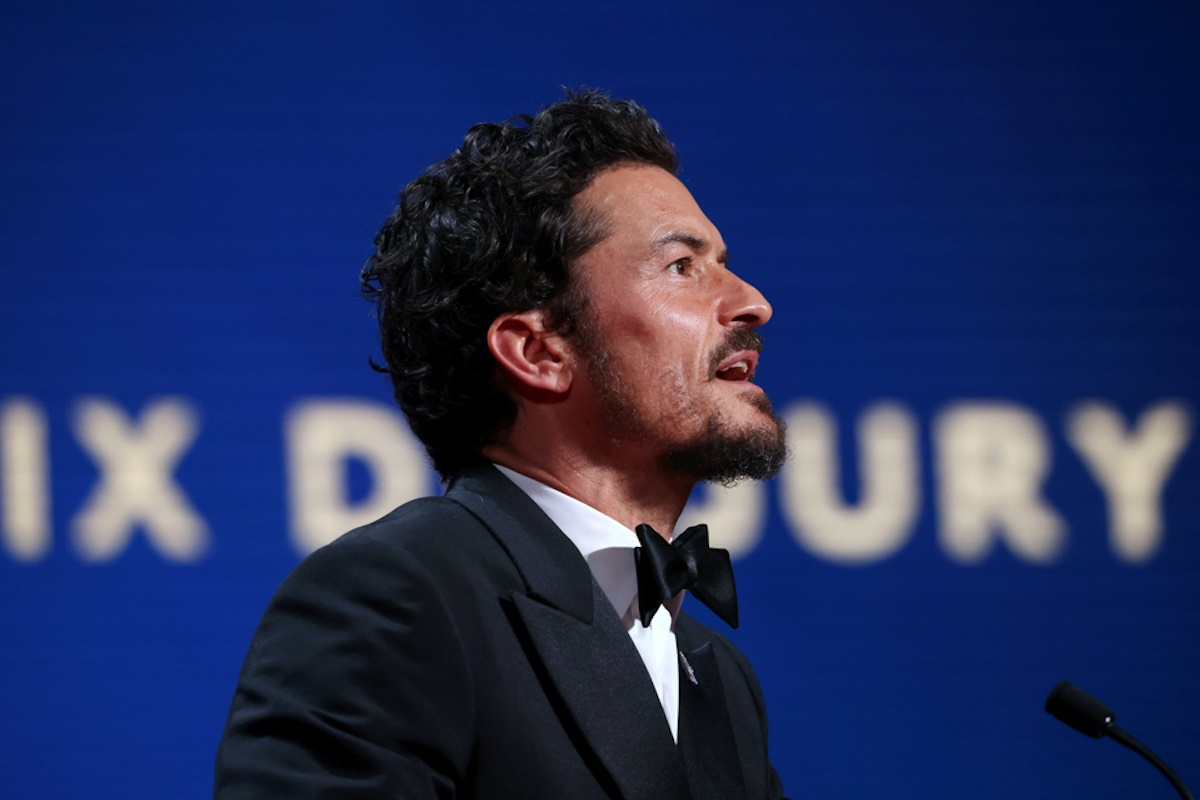 epa10658632 Orlando Bloom speaks onstage during the Closing Ceremony of the 76th annual Cannes Film Festival, in Cannes, France, 27 May 2023.  EPA
