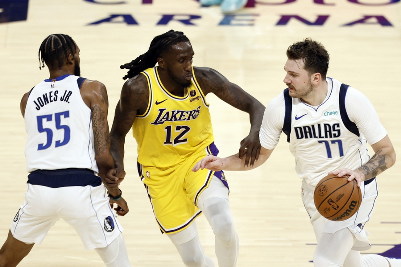 epa10990441 Dallas Mavericks forward-guard Luka Doncic (R) and forward Derrick Jones Jr. in action against Los Angeles Lakers forward Taurean Prince during the fourth quarter of the game between the Dallas Mavericks and the Los Angeles Lakers at Crypto.com Arena in Los Angeles, California, USA, 22 November 2023.  EPA
