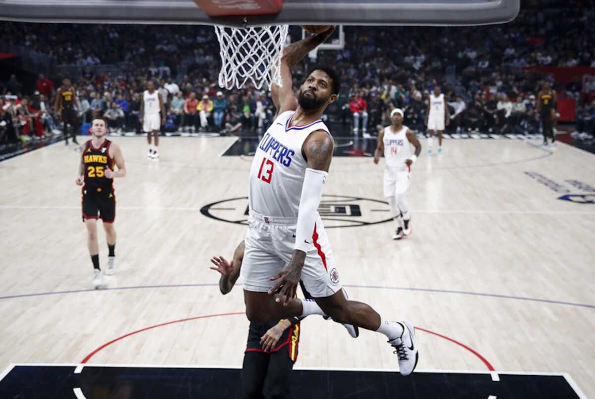 epa11227399 Los Angeles Clippers forward Paul George drives to the basket during the first half of the NBA basketball game between the Atlanta Hawks and the Los Angeles Clippers at Crypto.com Arena in Los Angeles, California, USA, 17 March 2024.  EPA