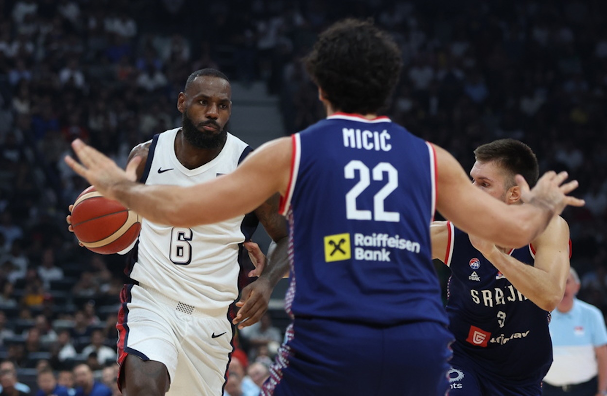 epa11484021 LeBron James (L) of the USA and Vasilije Micic of Serbia in action during the 2024 USA Basketball Showcase game between USA and Serbia in Abu Dhabi, United Arab Emirates, 17 July 2024.  EPA