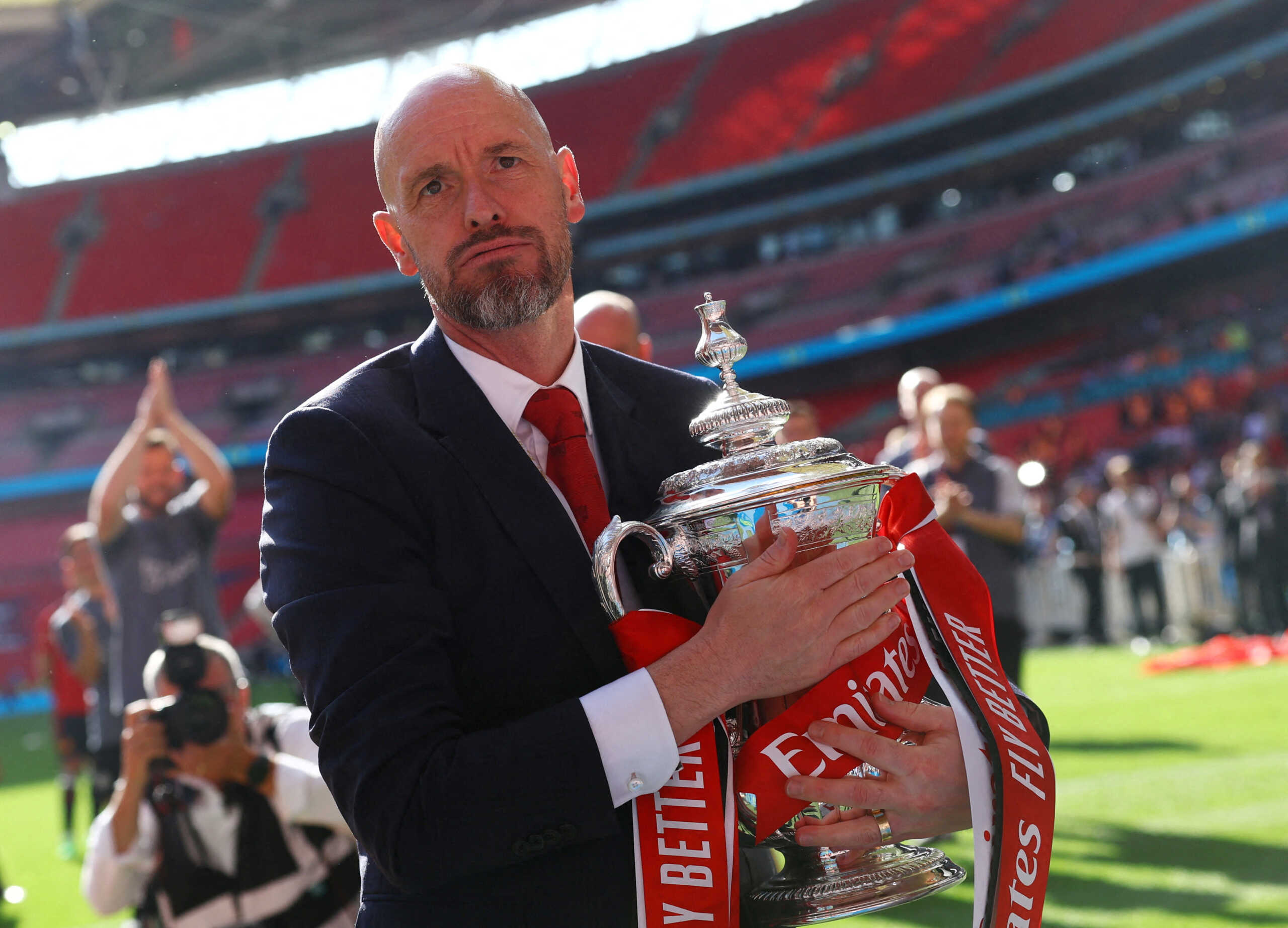 FILE PHOTO: Soccer Football - FA Cup - Final - Manchester City v Manchester United - Wembley Stadium, London, Britain - May 25, 2024 Manchester United manager Erik ten Hag celebrates with the trophy after winning the FA Cup REUTERS