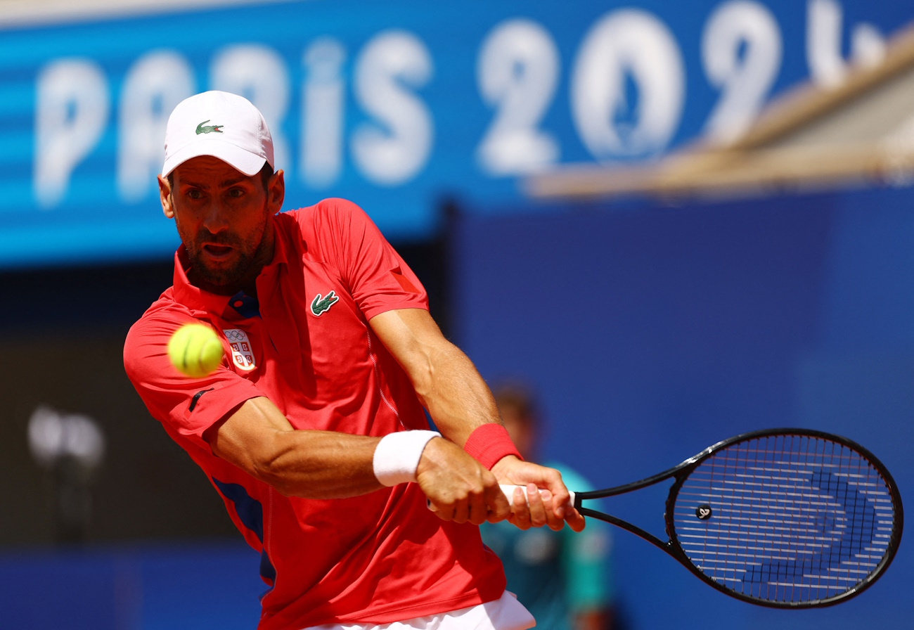 Paris 2024 Olympics - Tennis - Men's Singles Second Round - Roland-Garros Stadium, Paris, France - July 29, 2024. Novak Djokovic of Serbia in action during his match against Rafael Nadal of Spain. REUTERS