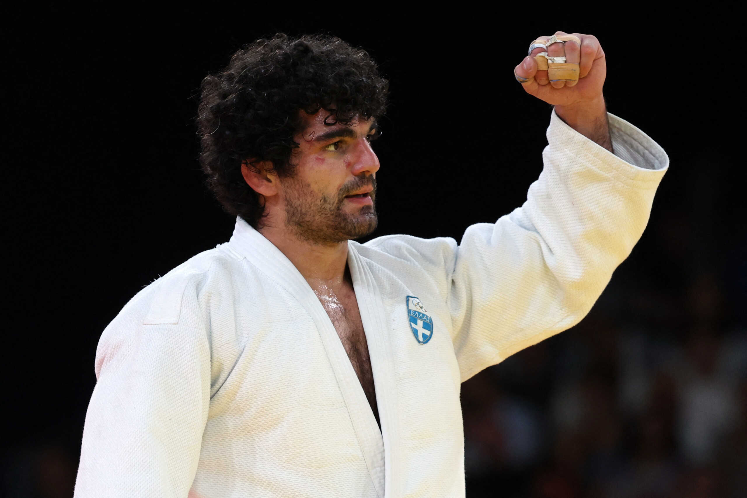 Paris 2024 Olympics - Judo - Men -90 kg Contest for Bronze Medal B - Champ de Mars Arena, Paris, France - July 31, 2024.  Theodoros Tselidis of Greece reacts after winning his bout against Tristani Mosakhlishvili of Spain. REUTERS