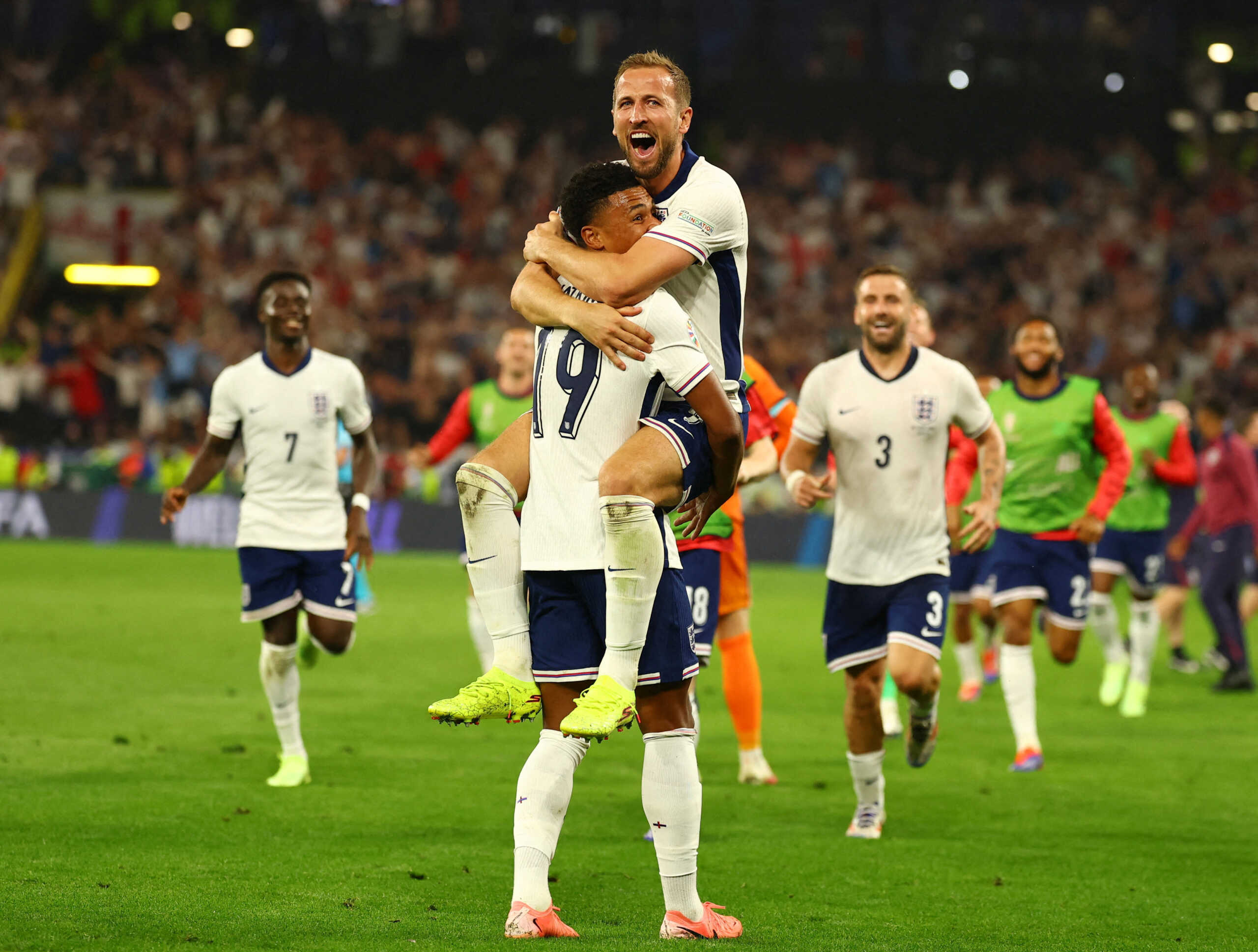 Soccer Football - Euro 2024 - Semi Final - Netherlands v England - Dortmund BVB Stadion, Dortmund, Germany - July 10, 2024  England's Harry Kane celebrates with Ollie Watkins after winning the match REUTERS