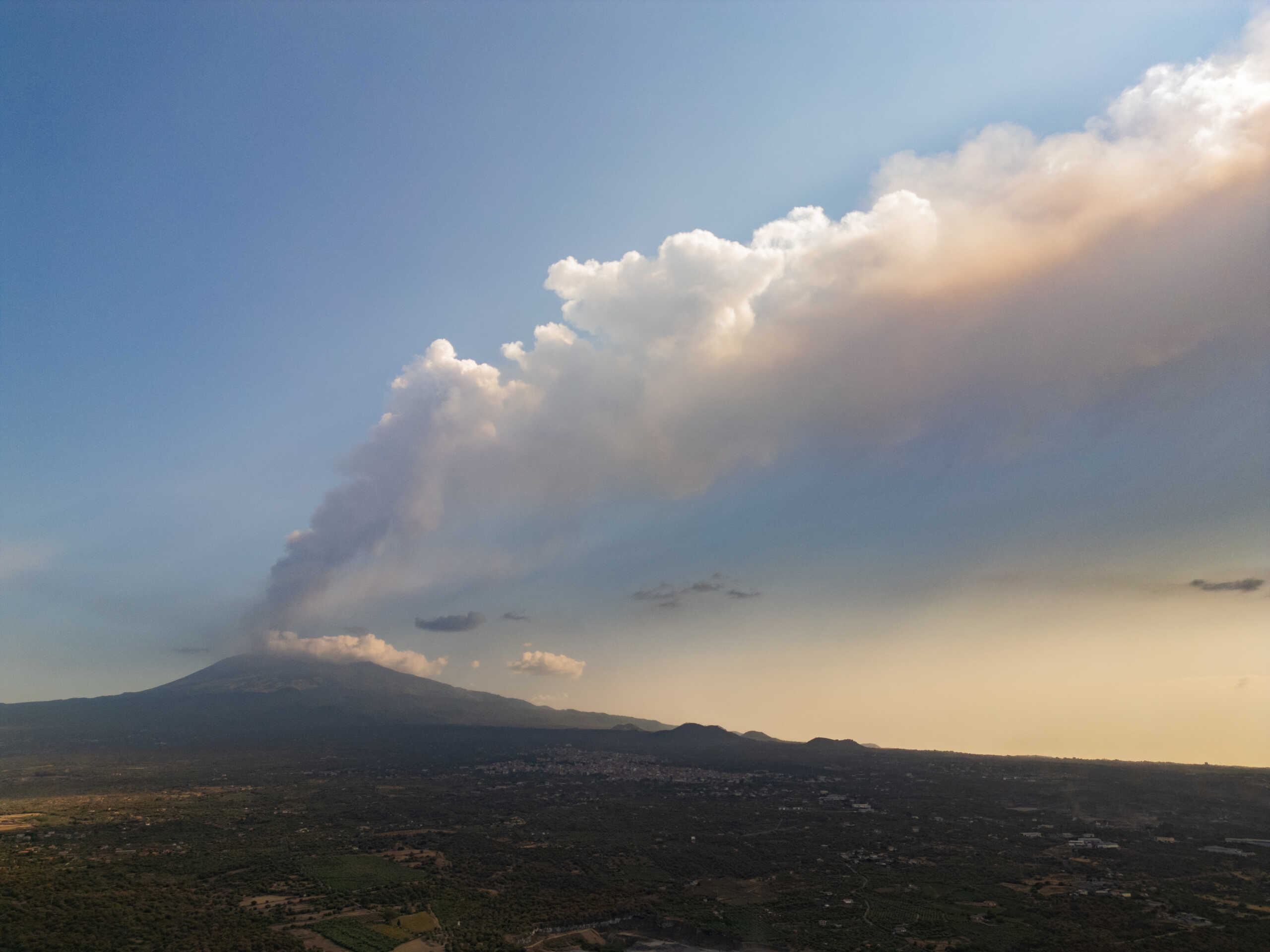 A drone view shows smoke rising from a crater of Mount Etna, Europe's most active volcano, in Belpasso, Italy July 23, 2024. REUTERS