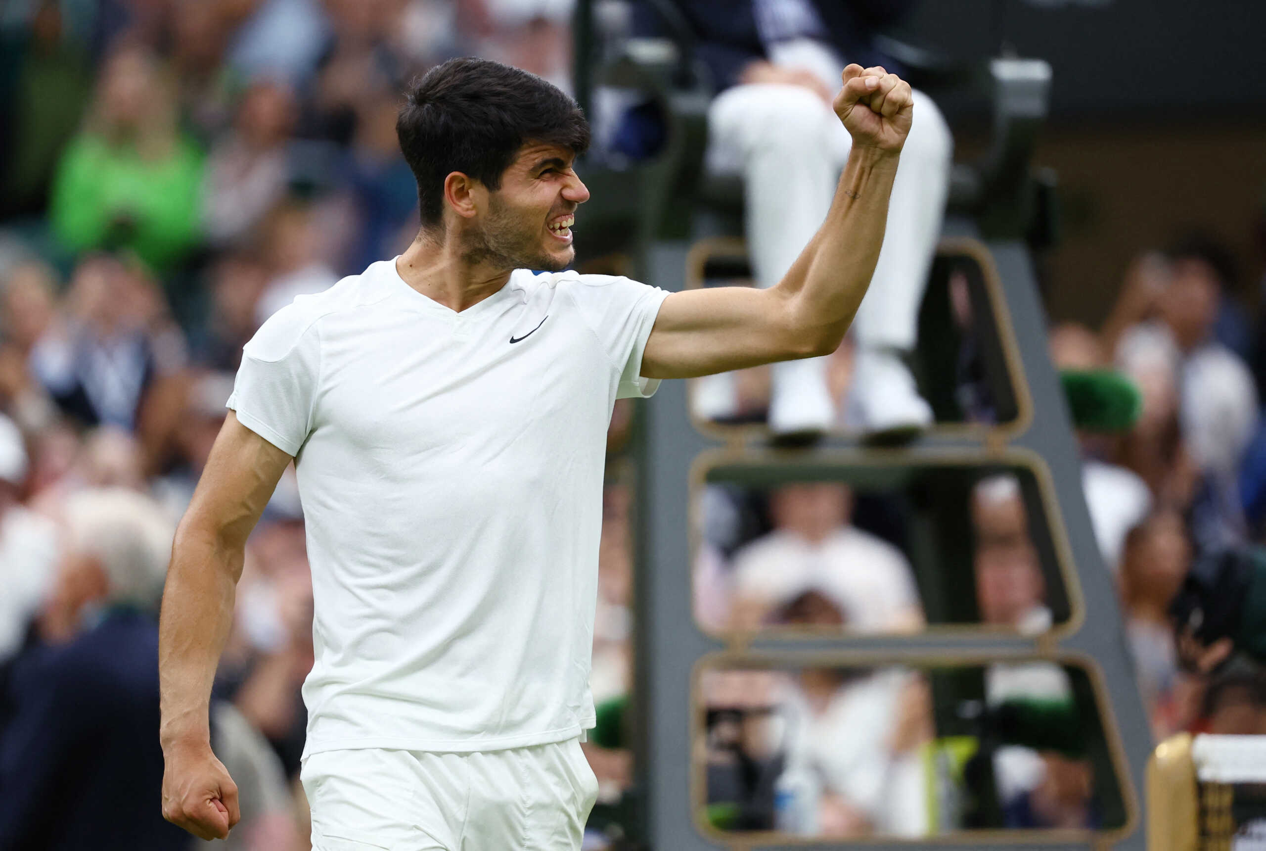 Tennis - Wimbledon - All England Lawn Tennis and Croquet Club, London, Britain - July 9, 2024 Spain's Carlos Alcaraz celebrates after winning his quarter final match against Tommy Paul of the U.S. REUTERS