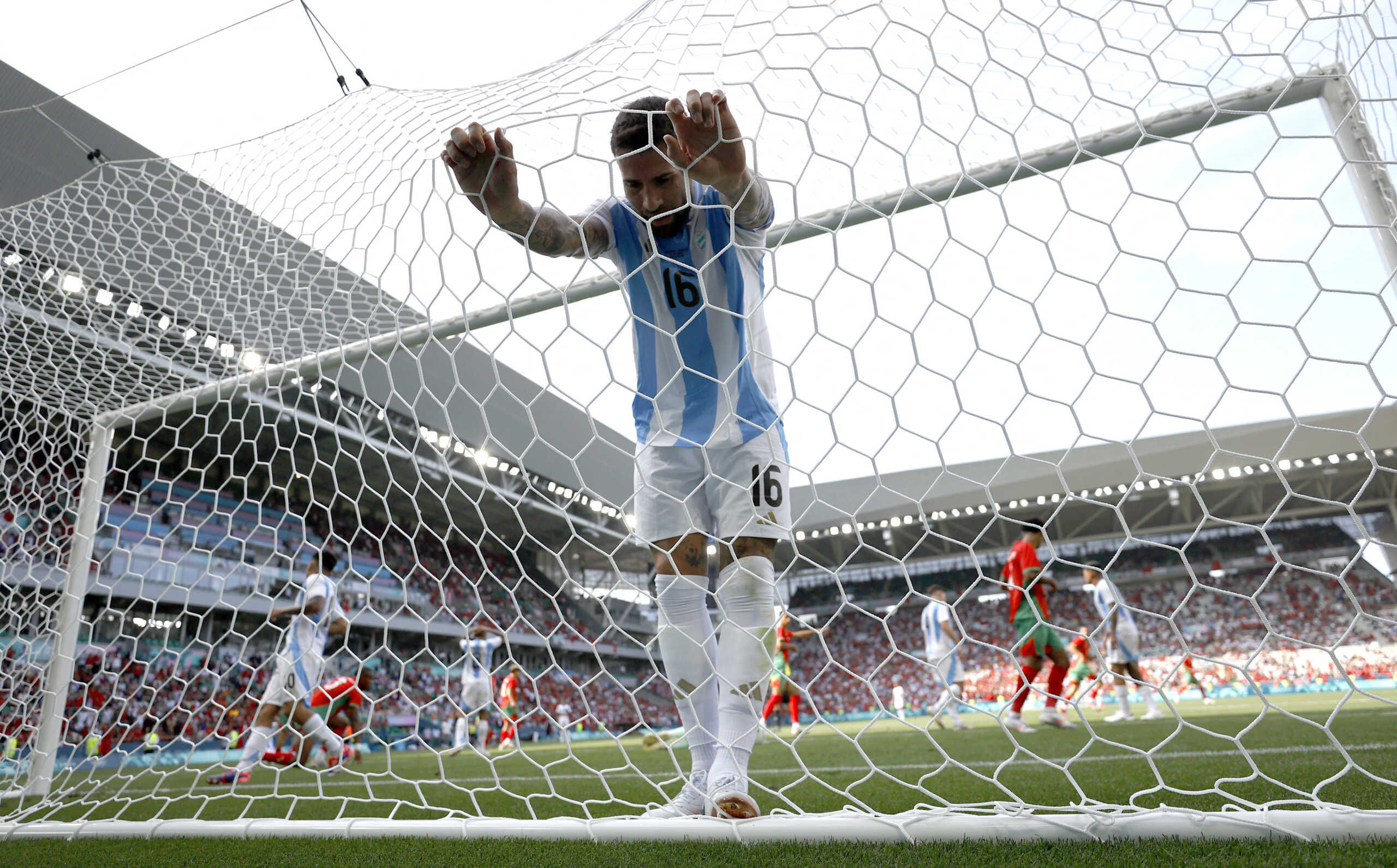 Paris 2024 Olympics - Football - Men's Group B - Argentina vs Morocco - Geoffroy-Guichard Stadium, Saint-Etienne, France - July 24, 2024. Nicolas Otamendi of Argentina reacts. REUTERS