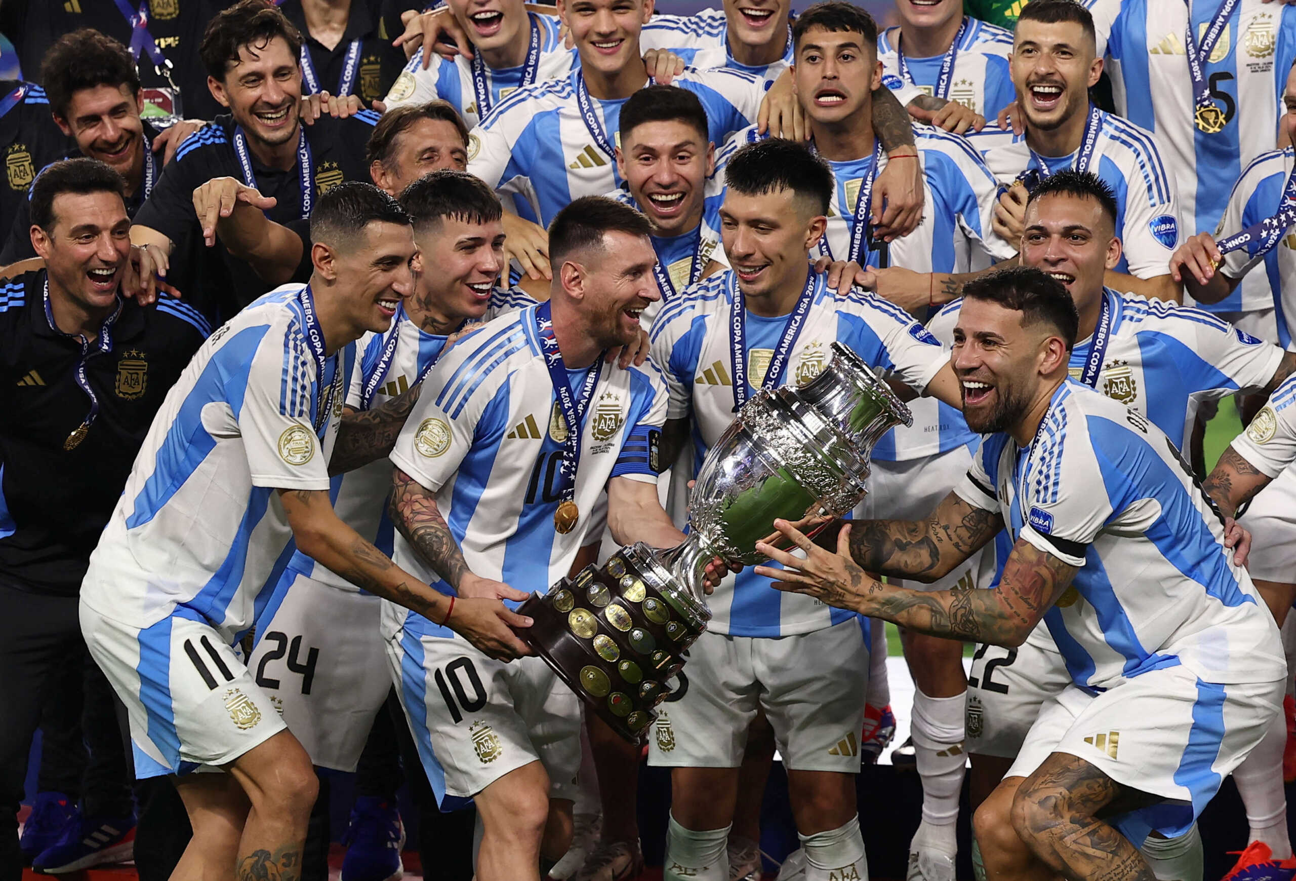 Soccer Football - Copa America 2024 - Final - Argentina v Colombia - Hard Rock Stadium, Miami, Florida, United States - July 15, 2024 Argentina's Lionel Messi lifts the trophy as he celebrates with teammates after winning Copa America 2024  REUTERS