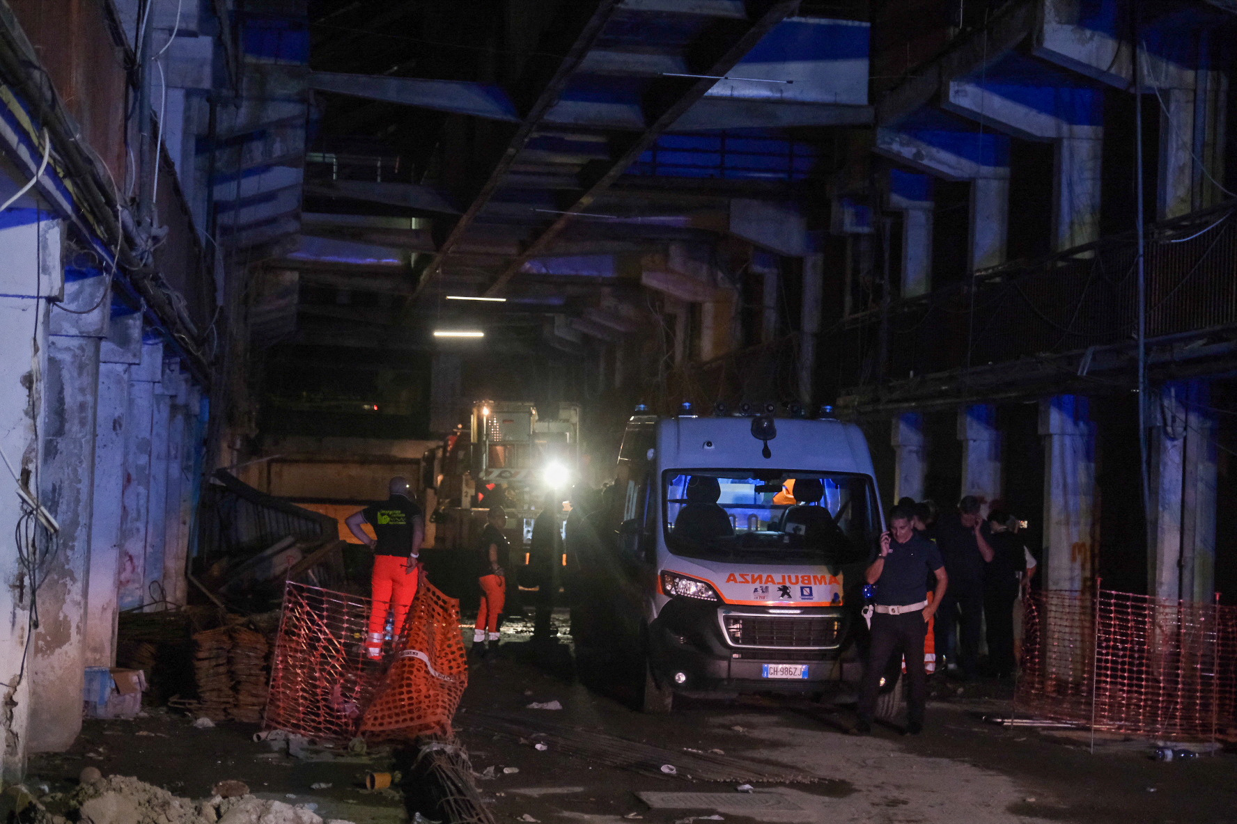 An ambulance is seen at the site of a collapsed balcony in Naples, Italy July 22, 2024. REUTERS