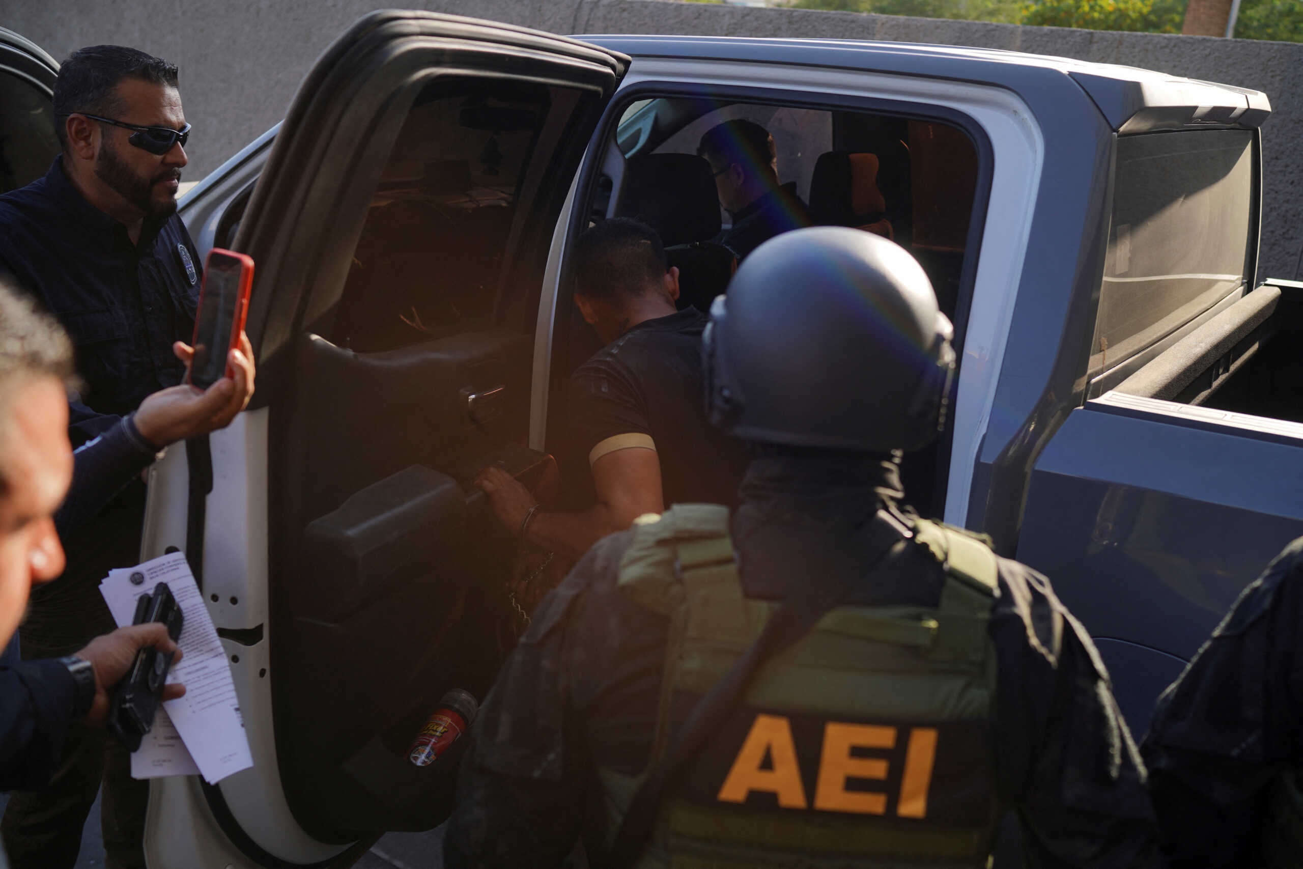 Sergio "N", the driver of the DiDi car and the main suspect in the suspected murder of Paola Banuelos, a 23-year-old woman who went missing days earlier after using the ride-hailing platform DiDi is detained by police officers after turning himself in Mexicali, Mexico. July 12, 2024. REUTERS