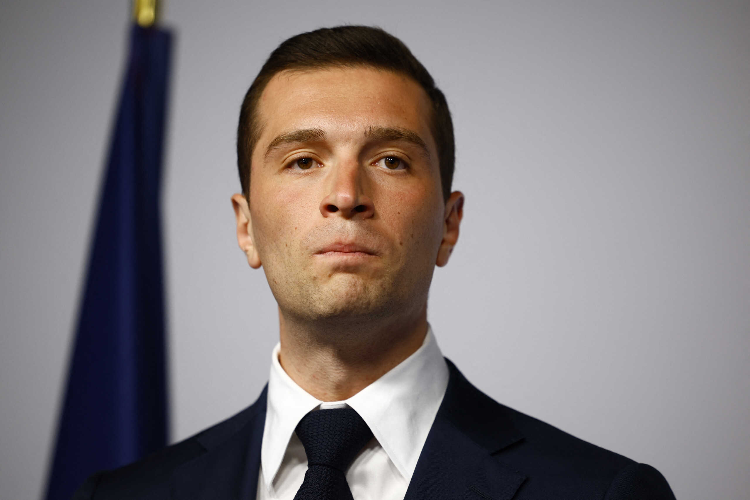 Jordan Bardella, President of the French far-right Rassemblement National (National Rally - RN) party, react on stage after partial results in the second round of the early French parliamentary elections in Paris, France, July 7, 2024. REUTERS