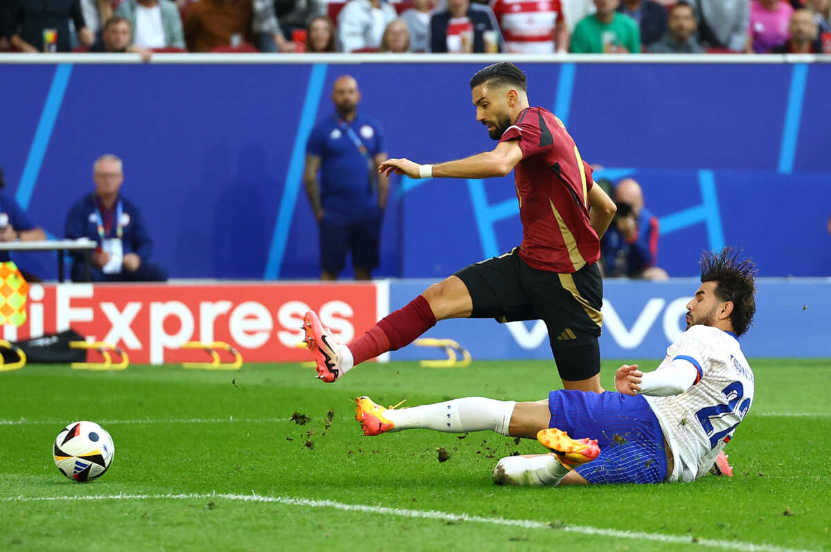 Soccer Football - Euro 2024 - Round of 16 - France v Belgium - Dusseldorf Arena, Dusseldorf, Germany - July 1, 2024 Belgium's Yannick Carrasco in action with France's Theo Hernandez REUTERS