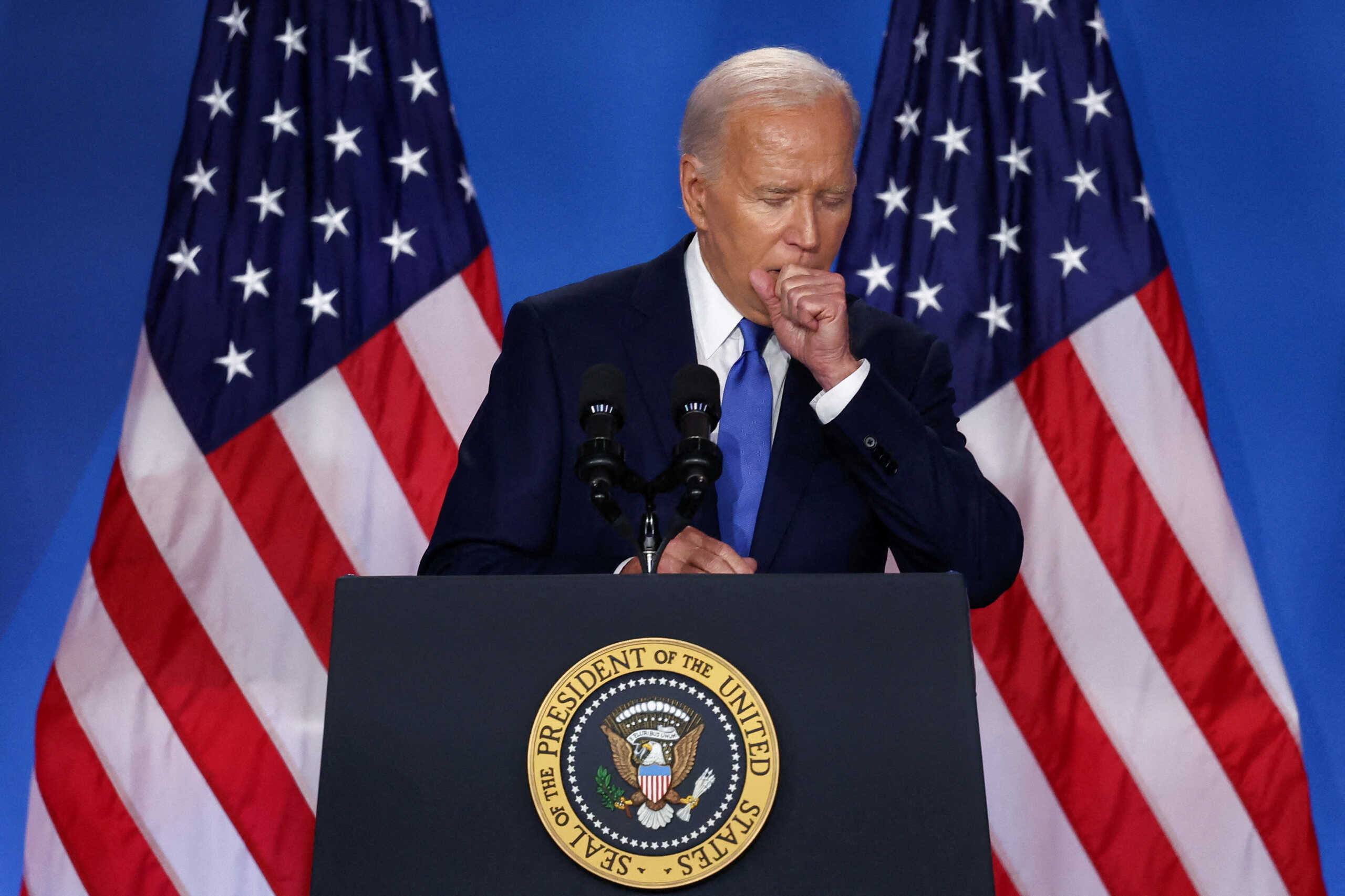 U.S. President Joe Biden coughs at a press conference during NATO's 75th anniversary summit, in Washington, U.S., July 11, 2024. REUTERS